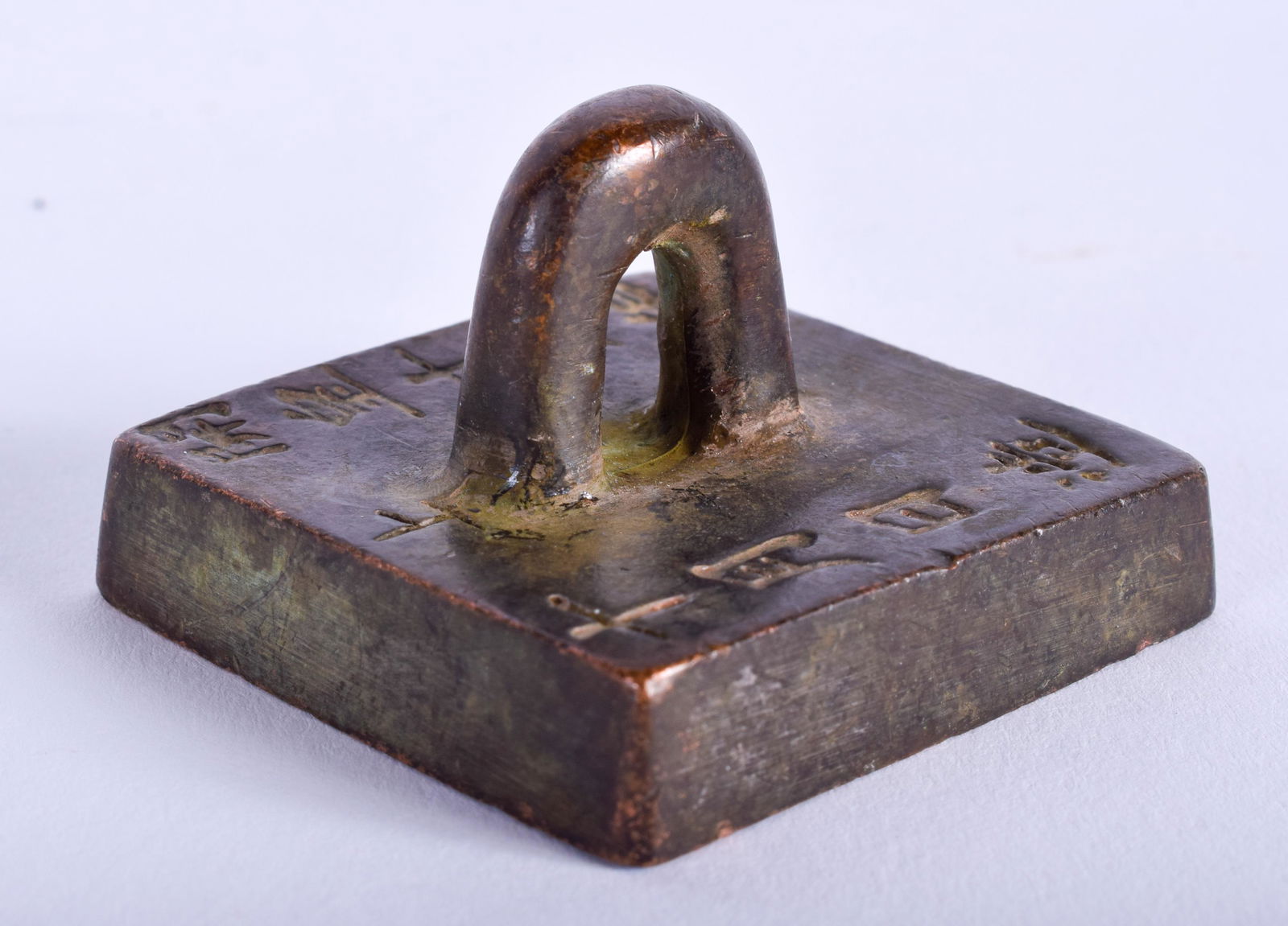 A CHINESE BRONZE SEAL. 5 cm square. (1 of 3)