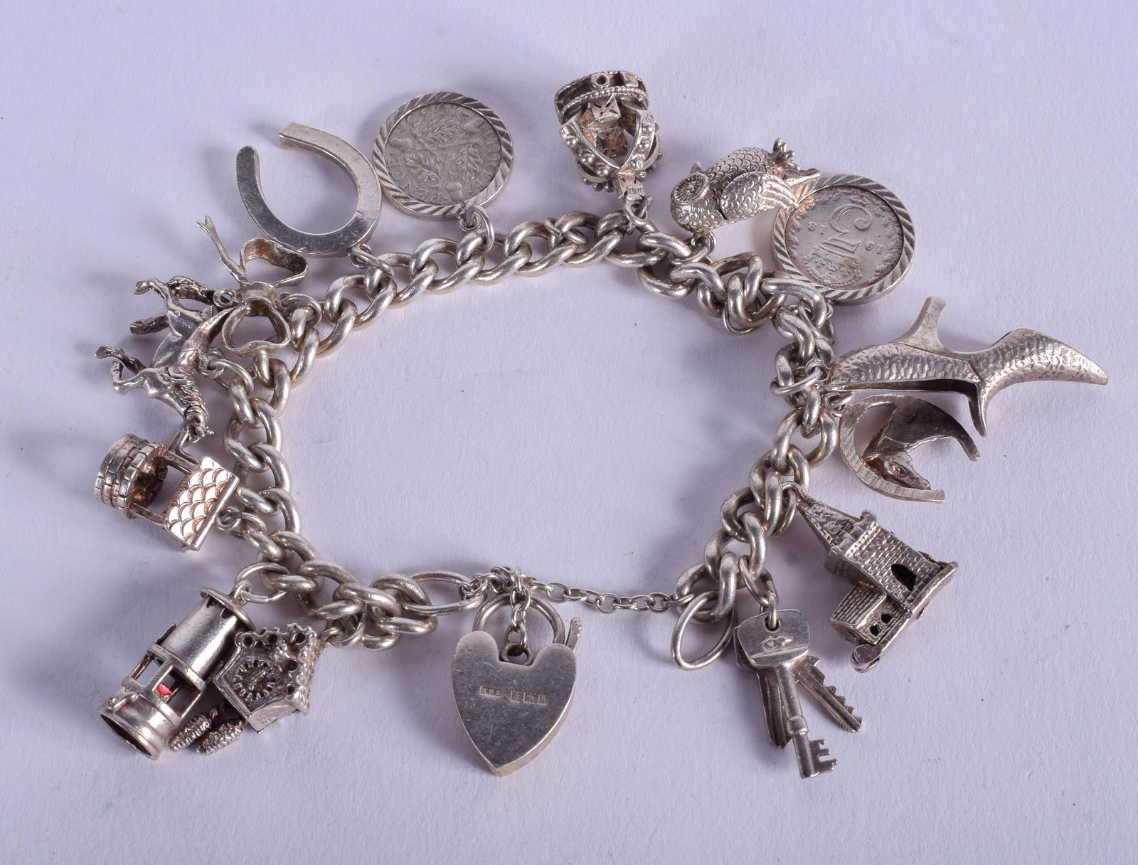 A SILVER CHARM BRACELET. 60 grams. (1 of 2)