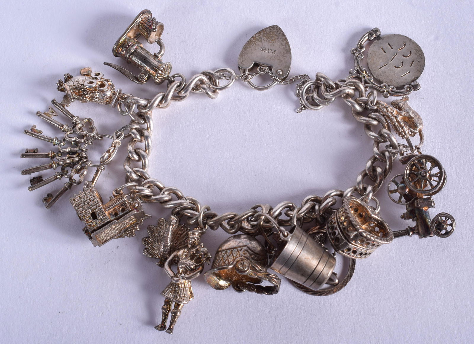 A SILVER CHARM BRACELET. 64 grams. (1 of 2)