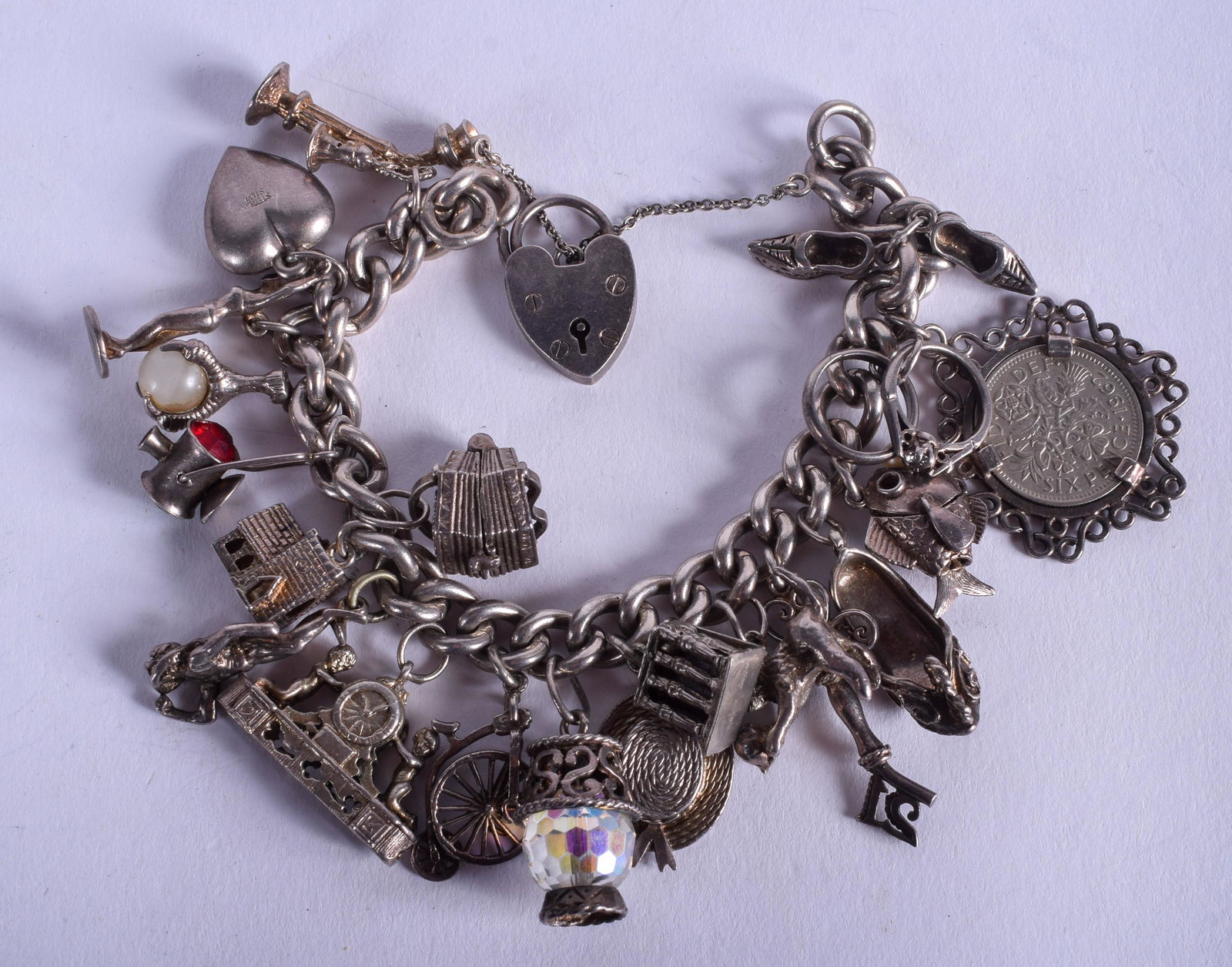A SILVER CHARM BRACELET. 99 grams. (1 of 2)