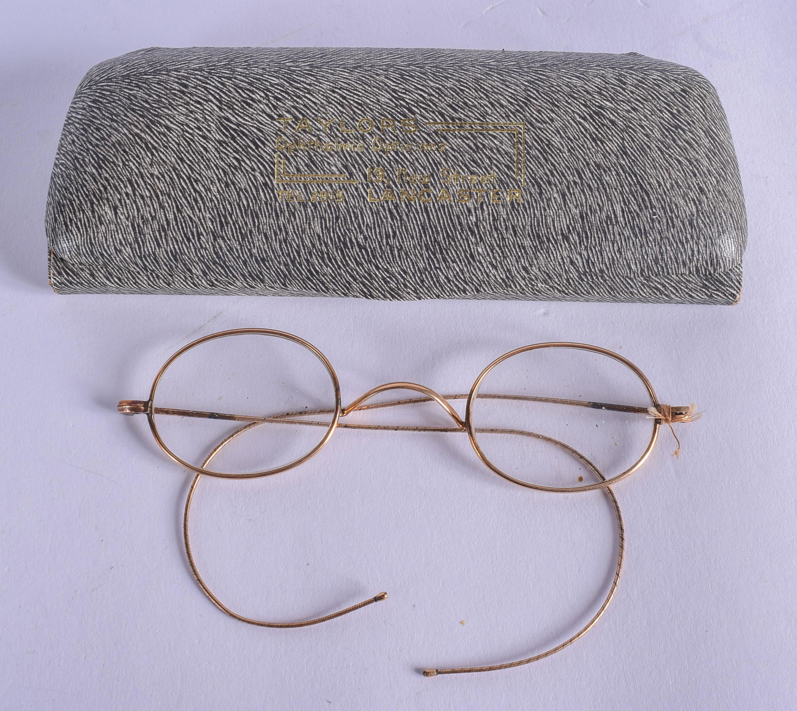 A PAIR OF EDWARDIAN YELLOW METAL GLASSES. 11 cm wide.: A PAIR OF EDWARDIAN YELLOW METAL GLASSES. 11 cm wide.