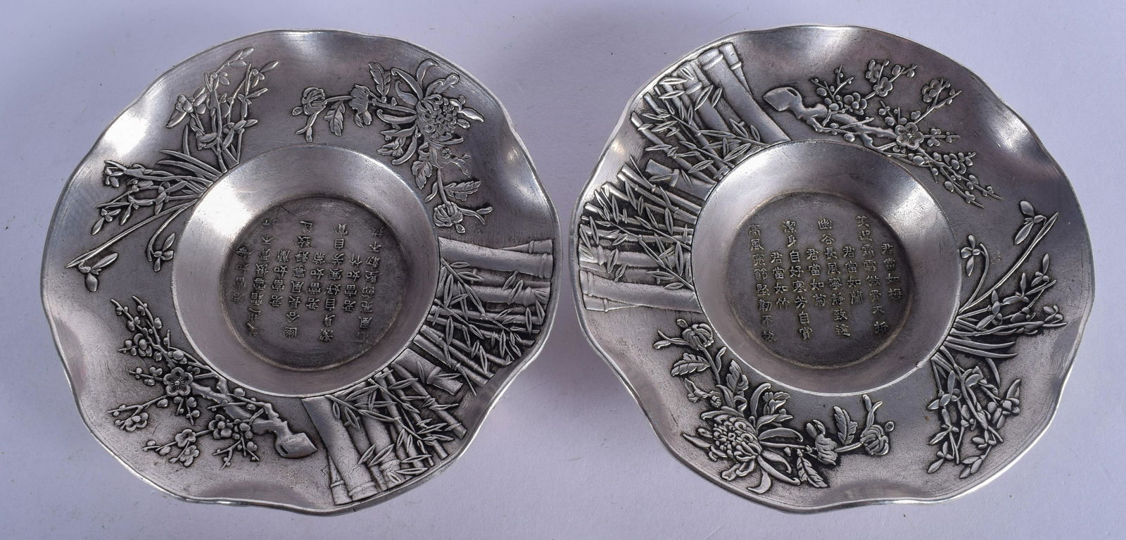 A PAIR OF SILVERED CHINESE DISHES. 11 cm wide. (1 of 2)