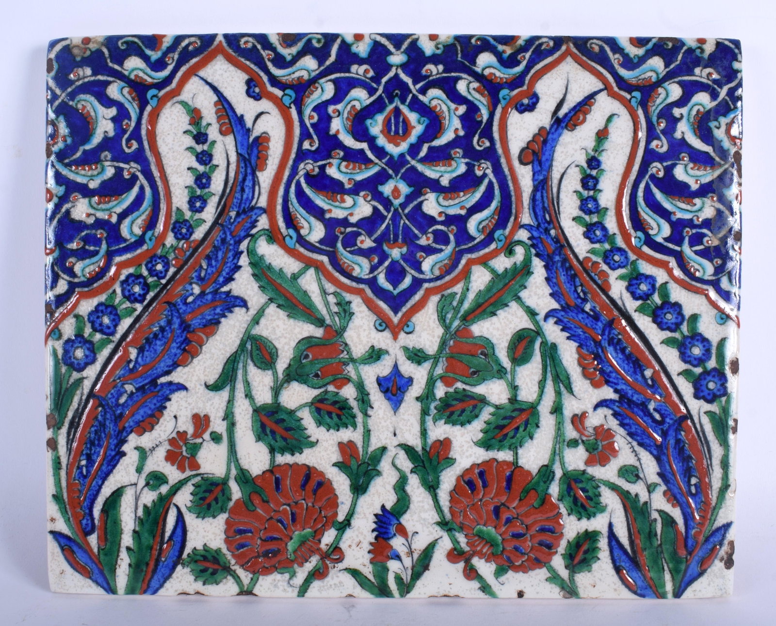 A LARGE TURKISH MIDDLE EASTERN IZNIK FAIENCE TILE: A LARGE TURKISH MIDDLE EASTERN IZNIK FAIENCE TILE painted with flowers. 32 cm x 26 cm,.