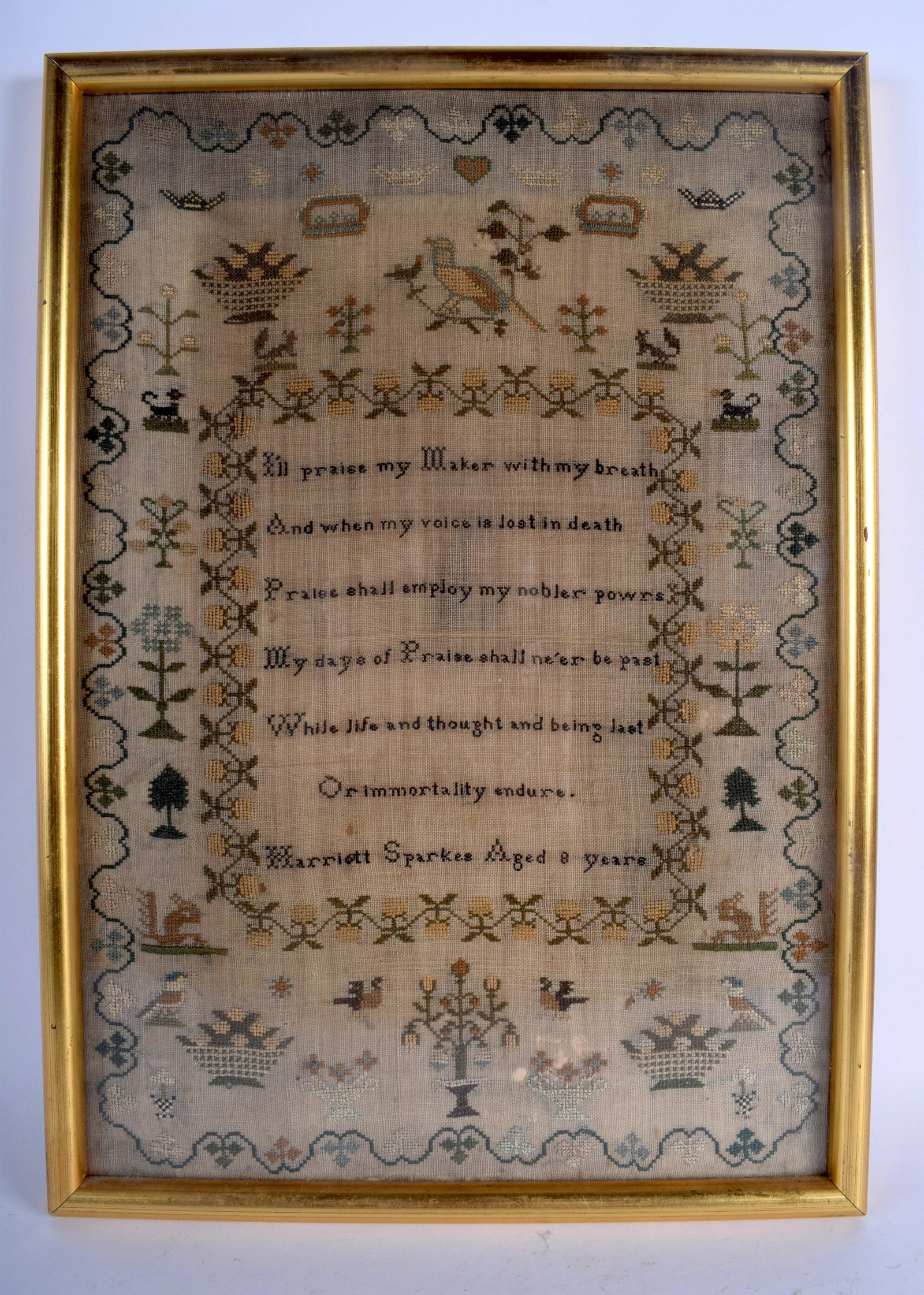 A MID 19TH CENTURY FRAMED EMBROIDERED SAMPLER by: A MID 19TH CENTURY FRAMED EMBROIDERED SAMPLER by Harriott Sparkes Aged 8 years. Image 30 cm x 43 cm.