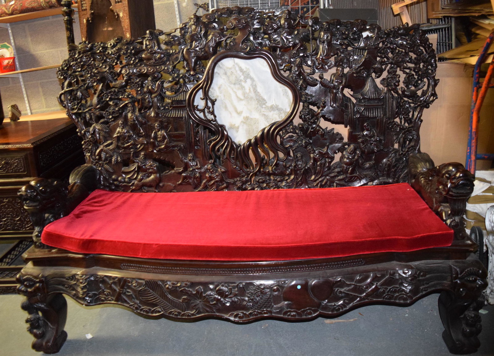 AN EARLY 20TH CENTURY CHINESE CARVED HARDWOOD THRONE: AN EARLY 20TH CENTURY CHINESE CARVED HARDWOOD THRONE CHAIR Qing, decorated with figures within extensive landscapes. 180 cm x 130 cm.