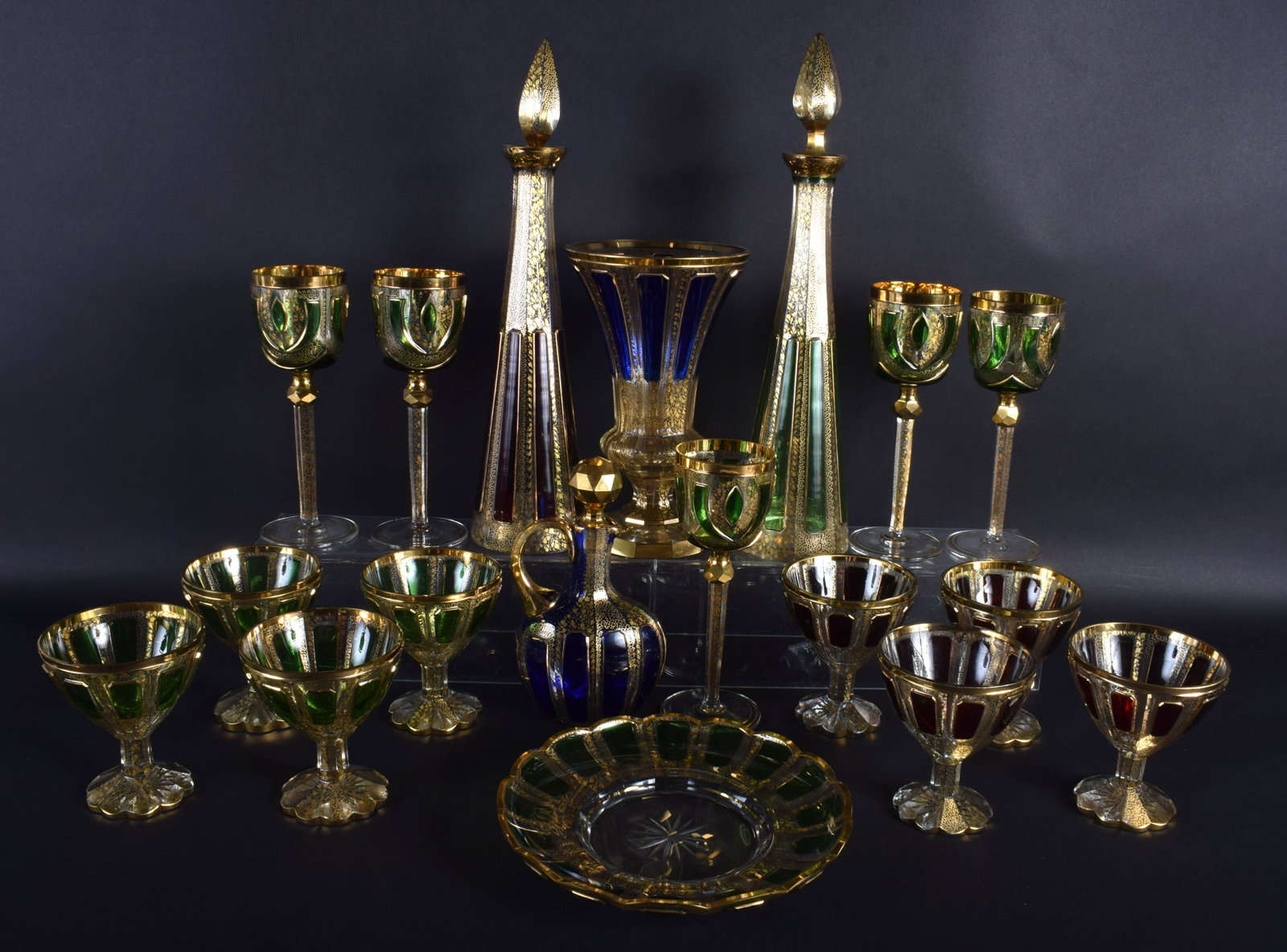A SUITE OF 19TH CENTURY BOHEMIAN ISLAMIC GLASSWARE: A SUITE OF 19TH CENTURY BOHEMIAN ISLAMIC GLASSWARE including decanters etc. (qty)
