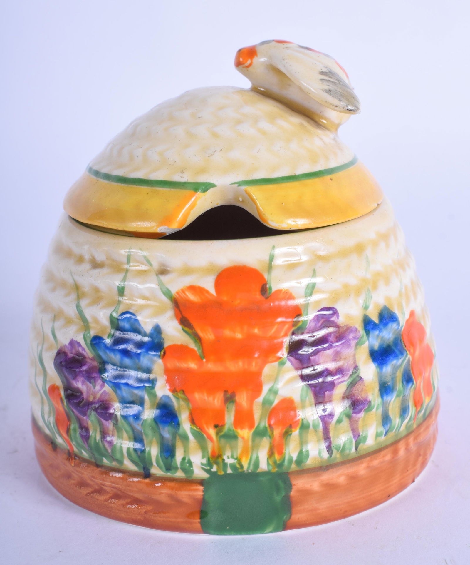 AN ART DECO CLARICE CLIFF BIZARRE CROCUS PRESERVE JAR.: AN ART DECO CLARICE CLIFF BIZARRE CROCUS PRESERVE JAR. 7.5 cm high.