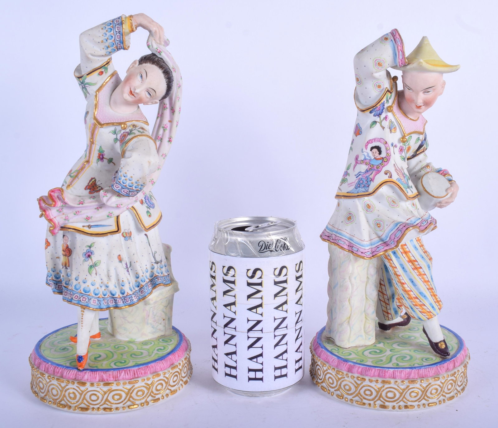 A PAIR OF 19TH CENTURY FRENCH BISQUE PARIS PORCELAIN: A PAIR OF 19TH CENTURY FRENCH BISQUE PARIS PORCELAIN FIGURES modelled upon circular bases. 26 cm high.