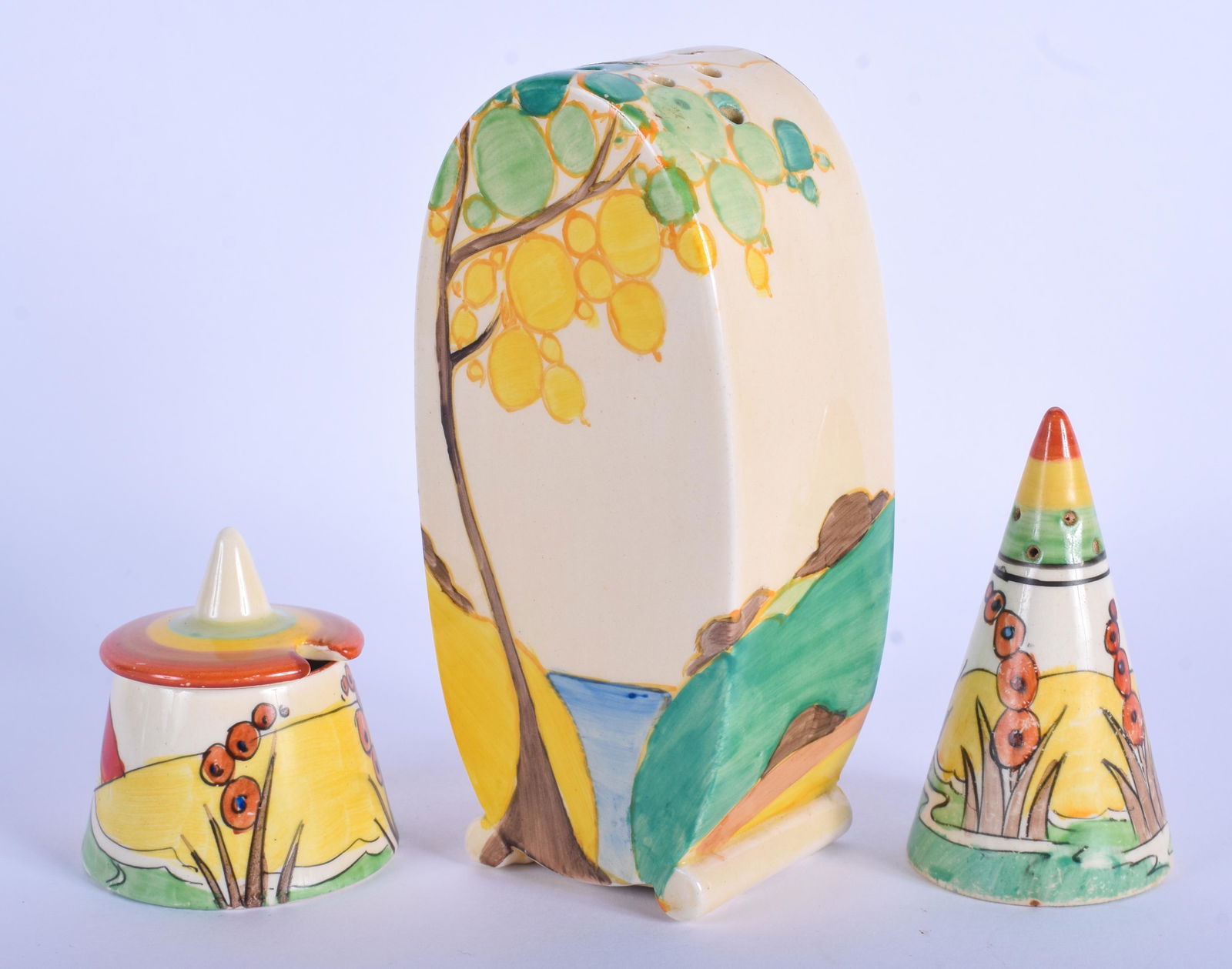 AN ART DECO CLARICE CLIFF SUGAR SIFTER together with a: AN ART DECO CLARICE CLIFF SUGAR SIFTER together with a smaller pepper pot & a mustard pot. Largest 14 cm high. (3)