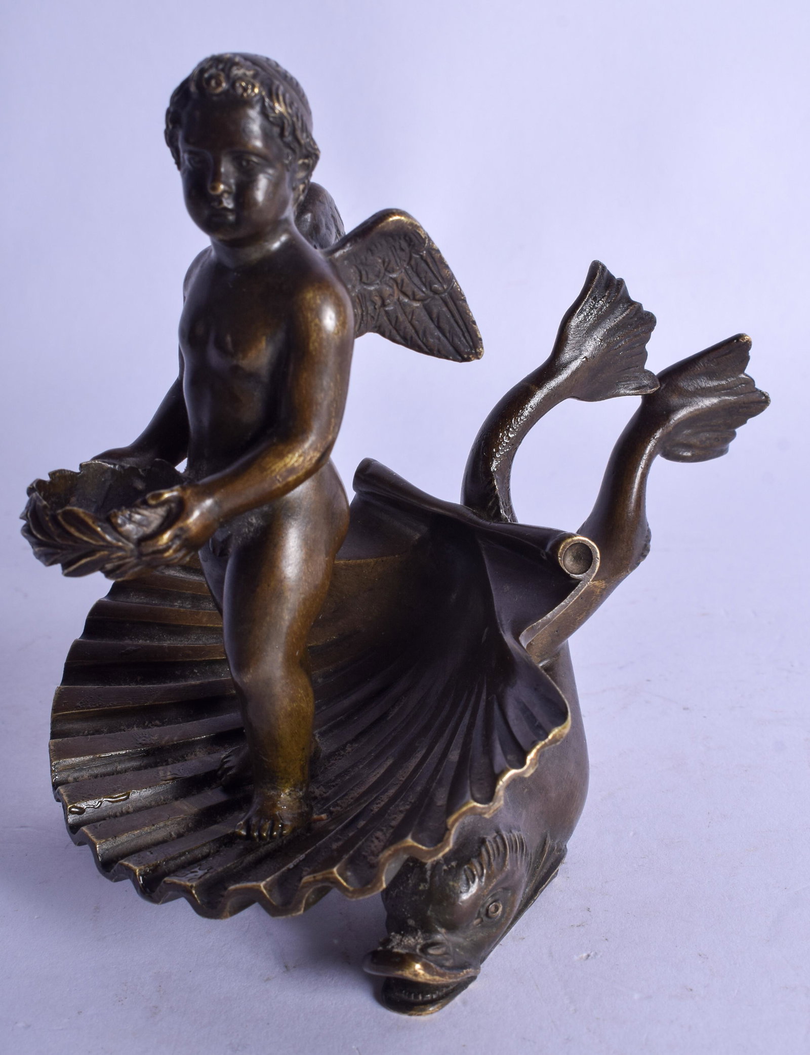 A 19TH CENTURY CONTINENTAL GRAND TOUR BRONZE FIGURE OF: A 19TH CENTURY CONTINENTAL GRAND TOUR BRONZE FIGURE OF A BOY modelled riding upon a shell. 13 cm x 11 cm.