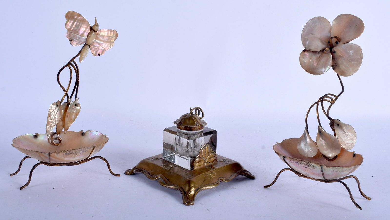 A FRENCH ART NOUVEAU BRASS INKWELL together with a pair: A FRENCH ART NOUVEAU BRASS INKWELL together with a pair of Palais Royale trinket dishes. 22 cm & 7 high. (3)