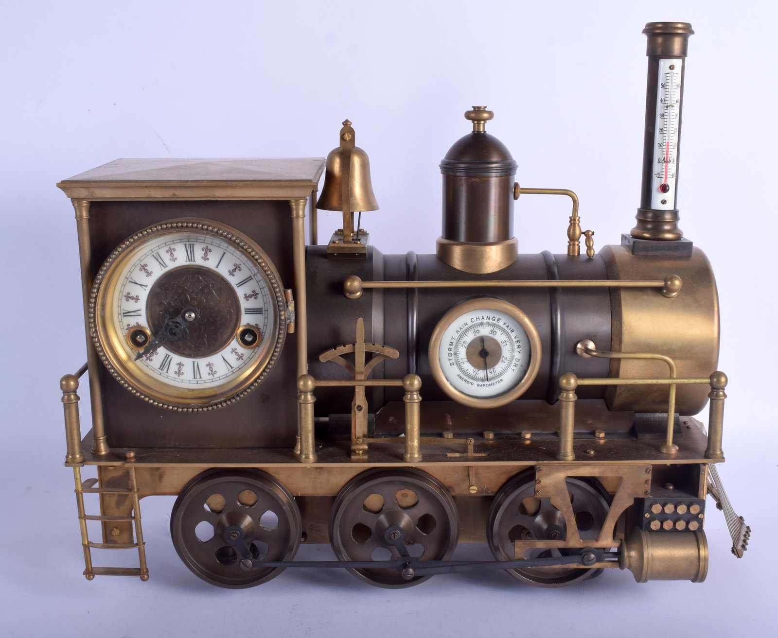 A LARGE UNUSUAL BRONZE INDUSTRIAL LOCOMOTIVE CLOCK with: A LARGE UNUSUAL BRONZE INDUSTRIAL LOCOMOTIVE CLOCK with barometer and thermometer. 40 cm x 38 cm.