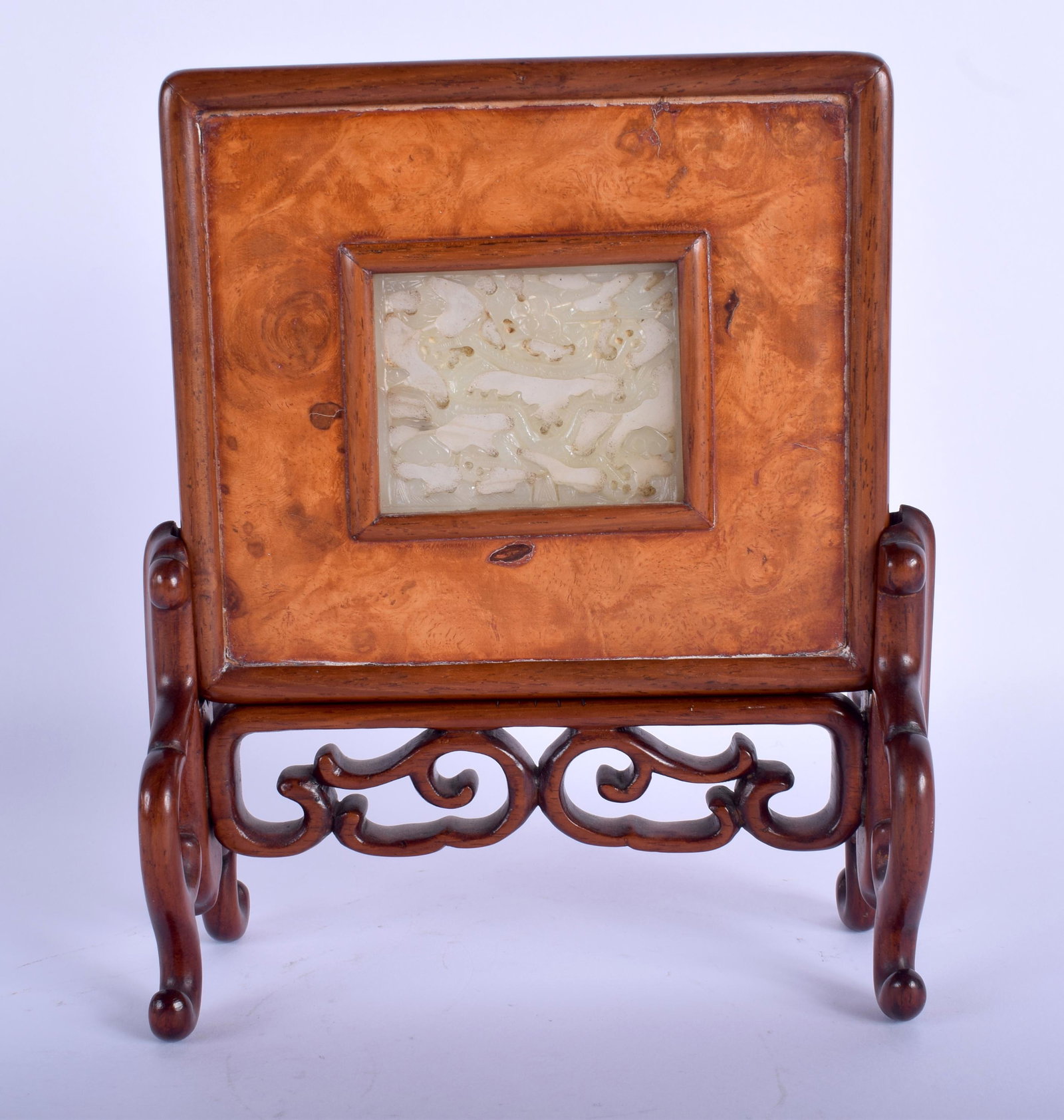 A 19TH CENTURY CHINESE PALE CELADON JADE BURR WOOD: A 19TH CENTURY CHINESE PALE CELADON JADE BURR WOOD TABLE SCREEN Qing, unusually carved to both sides. 20 cm x 15 cm, Jade 6 cm x 6 cm. Note: See the use of hardwood & jade, Lot 1005, Christies, 6th No