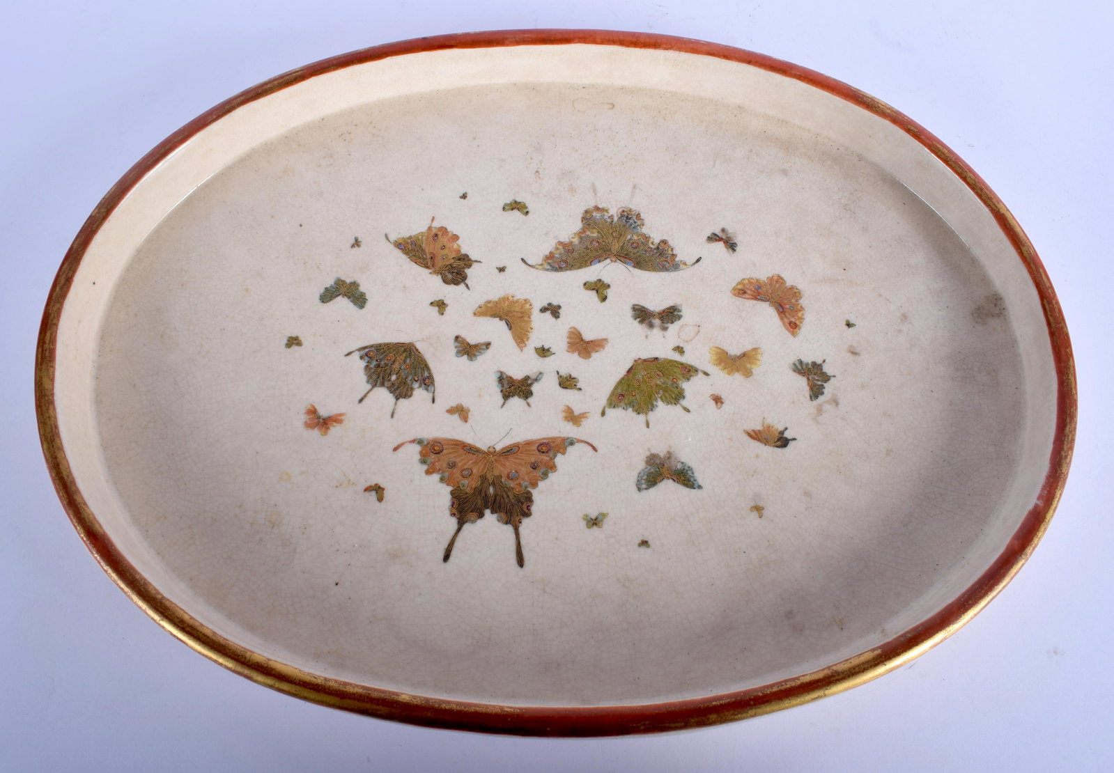 AN EARLY 20TH CENTURY JAPANESE MEIJI PERIOD SATSUMA: AN EARLY 20TH CENTURY JAPANESE MEIJI PERIOD SATSUMA TRAY by Senzan, painted with butterflies. 34 cm x 26 cm.
