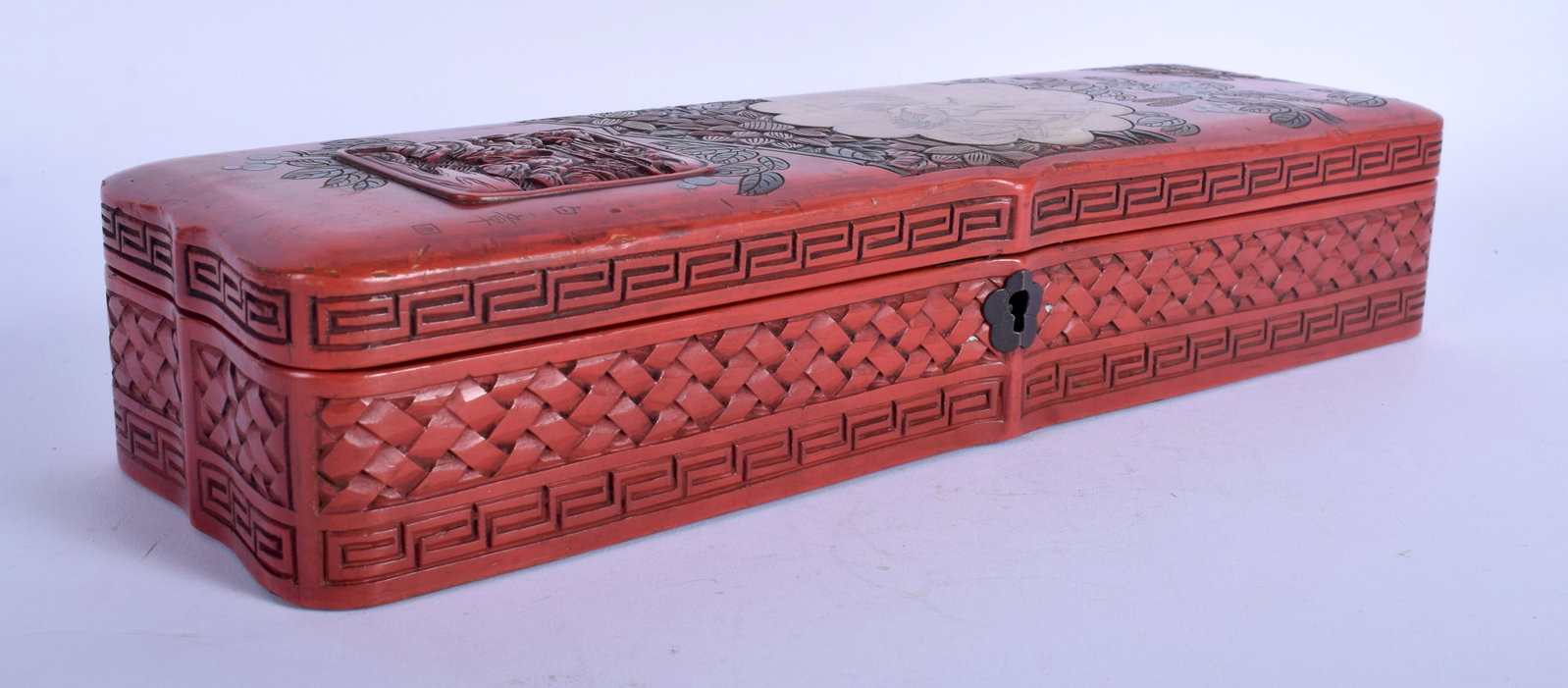 A RARE EARLY 20TH CENTURY JAPANESE MEIJI PERIOD RED: A RARE EARLY 20TH CENTURY JAPANESE MEIJI PERIOD RED LACQUER BOX decorated with panels of birds and landscapes. 30 cm x 9 cm.