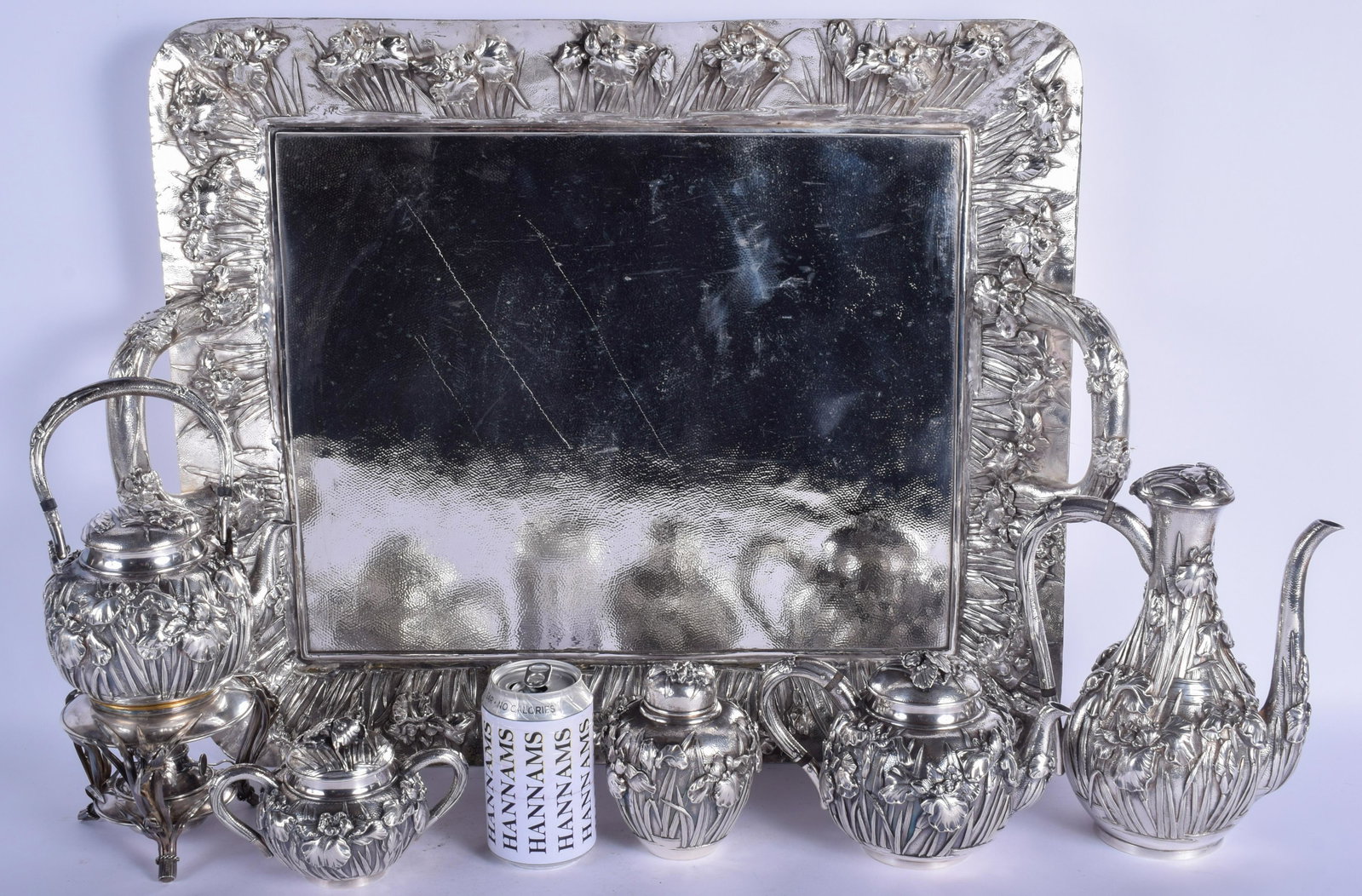 A FINE AND RARE LARGE 19TH CENTURY JAPANESE MEIJI: A FINE AND RARE LARGE 19TH CENTURY JAPANESE MEIJI PERIOD SILVER TEASET with matching tray, decorated in relief with foliage and extensive vines. 7016 grams. Tray 58 cm x 48 cm, largest pot 24 cm x 15 