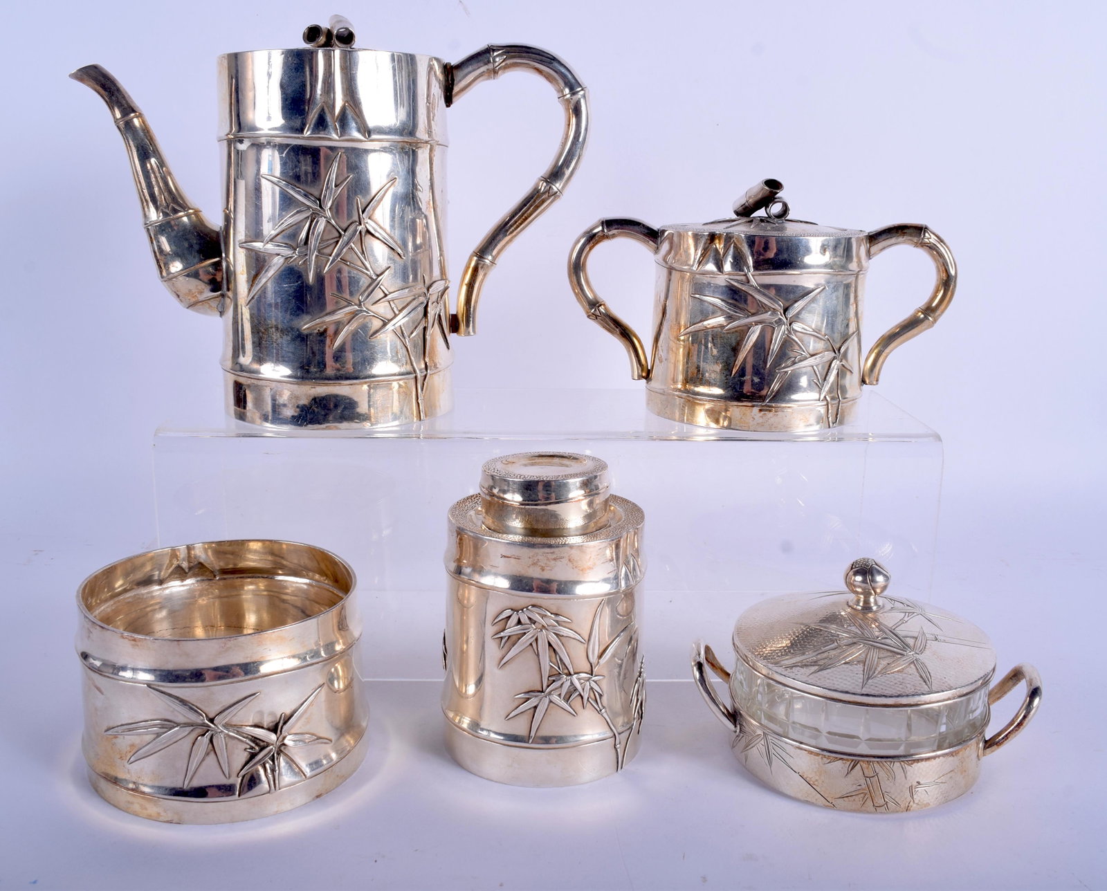 AN EARLY 20TH CENTURY JAPANESE MEIJI PERIOD SILVER: AN EARLY 20TH CENTURY JAPANESE MEIJI PERIOD SILVER TEASET decorated with flowering bamboo. 1350 grams. Largest 15 cm x 17 cm. (5)