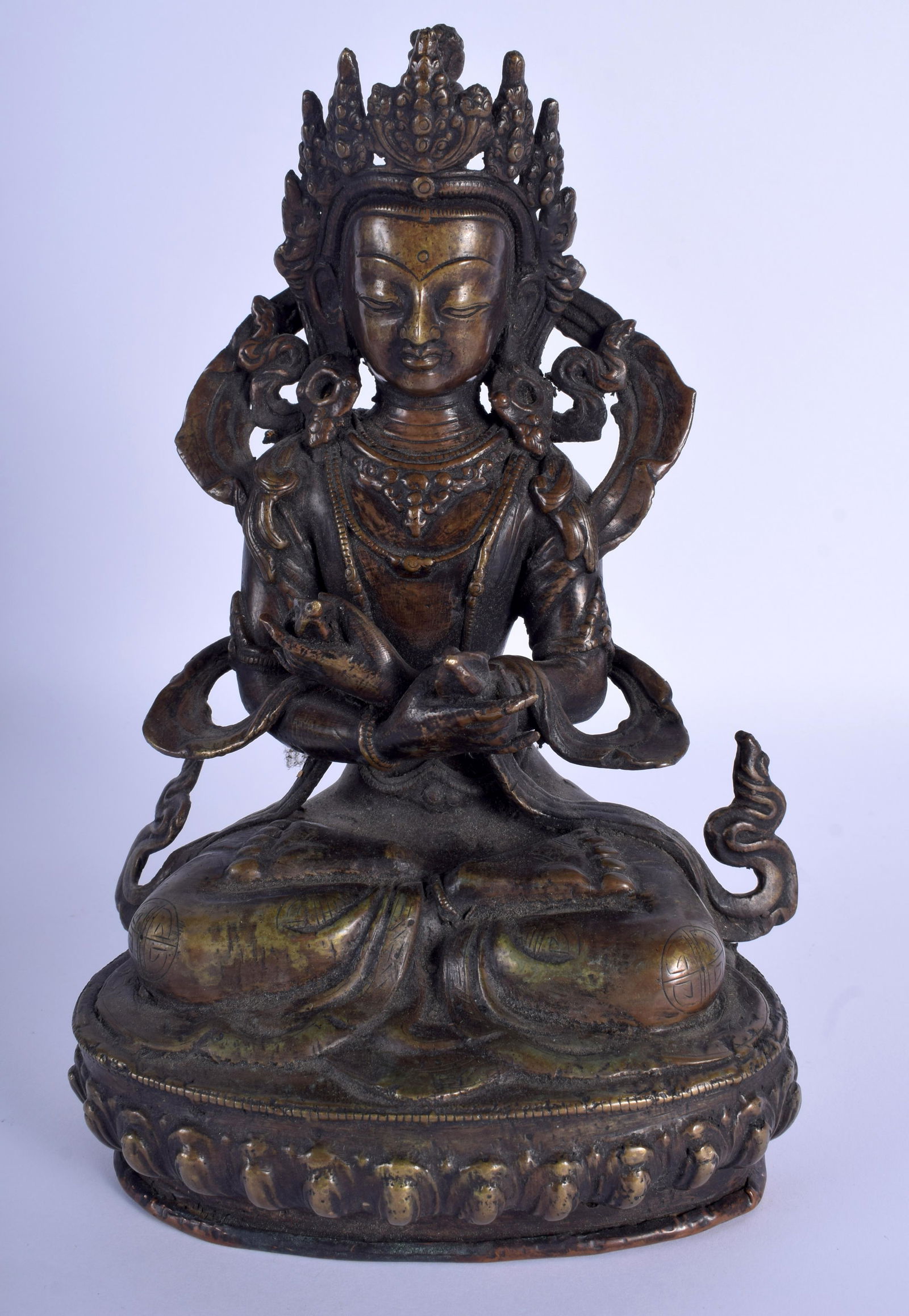 AN EARLY 20TH CENTURY CHINESE TIBETAN BRONZE BUDDHA: AN EARLY 20TH CENTURY CHINESE TIBETAN BRONZE BUDDHA upon a lotus base. 27 cm x 14 cm.
