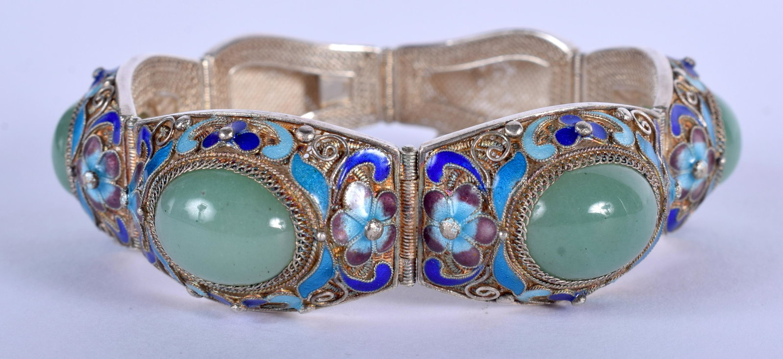 AN EARLY 20TH CENTURY CHINESE SILVER ENAMEL AND JADEITE: AN EARLY 20TH CENTURY CHINESE SILVER ENAMEL AND JADEITE BRACELET decorated with foliage. 47.2 grams. 14 cm long.
