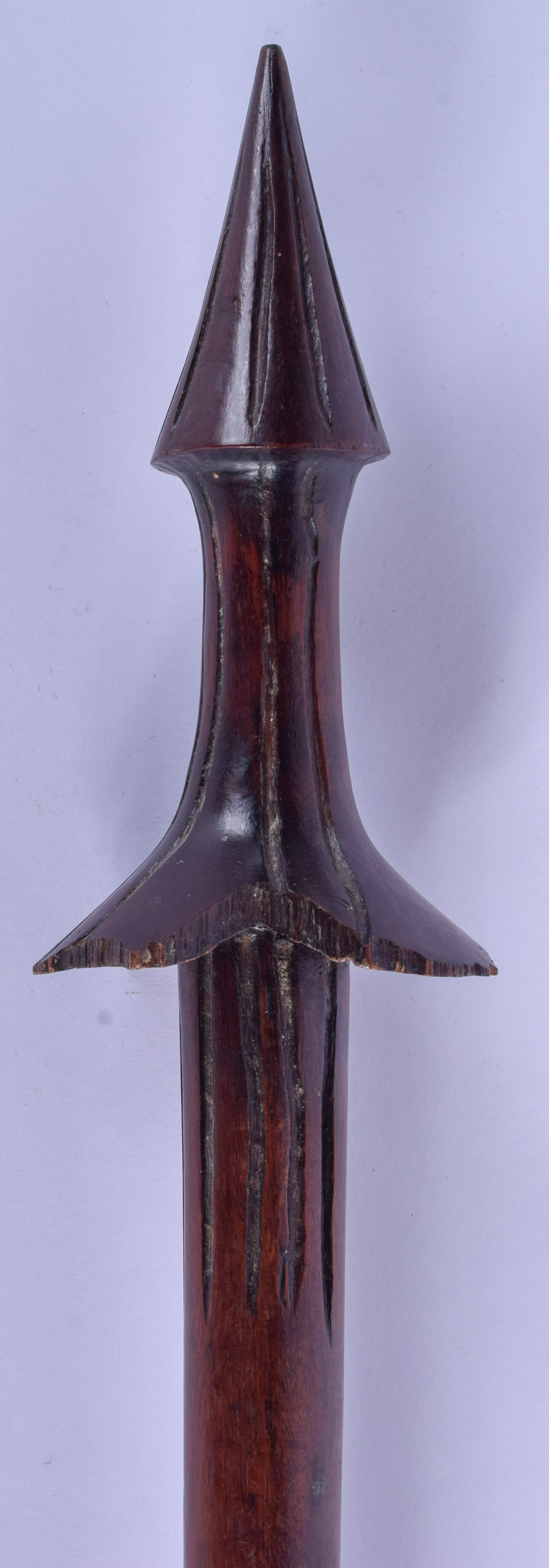 AN EARLY 20TH CENTURY VANATAU WOODEN SPEAR CLUB, formed: AN EARLY 20TH CENTURY VANATAU WOODEN SPEAR CLUB, formed with a rope twist grip. 118 cm long.