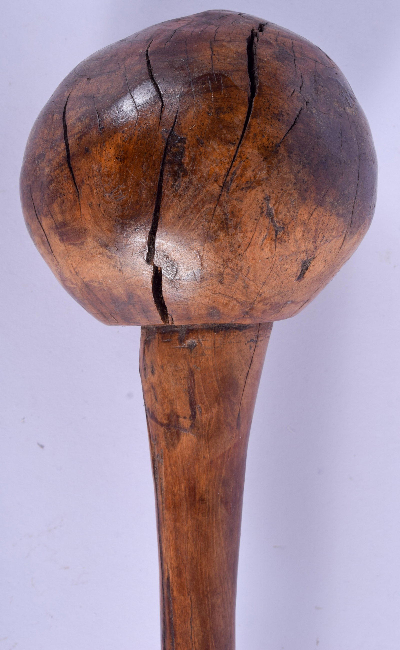 AN EARLY 20TH CENTURY FIJIAN TRIBAL THROWING CLUB,: AN EARLY 20TH CENTURY FIJIAN TRIBAL THROWING CLUB, carved geometric pattern to handle 43 cm long.