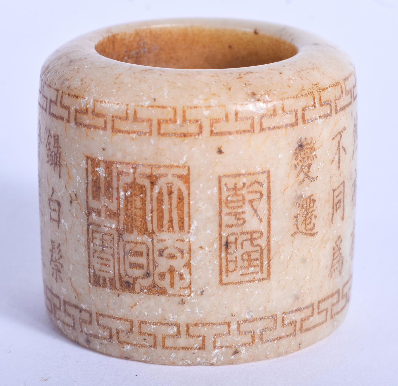 A CHINESE CARVED JADE ARCHERS RING. 3.25 cm wide. (1 of 3)