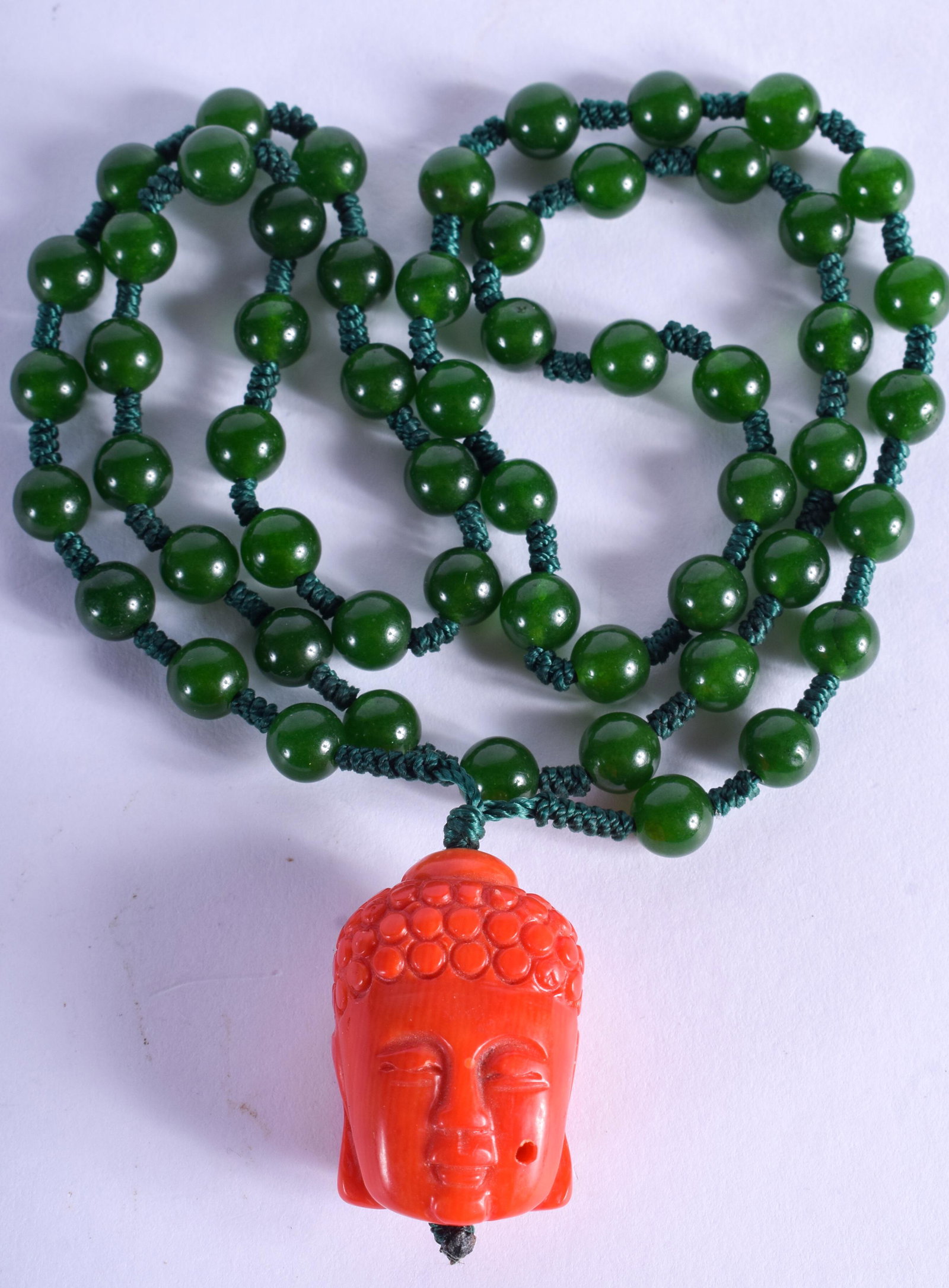 A CHINESE CORAL AND JADEITE NECKLACE. Jadeite 60 cm: A CHINESE CORAL AND JADEITE NECKLACE. Jadeite 60 cm long.