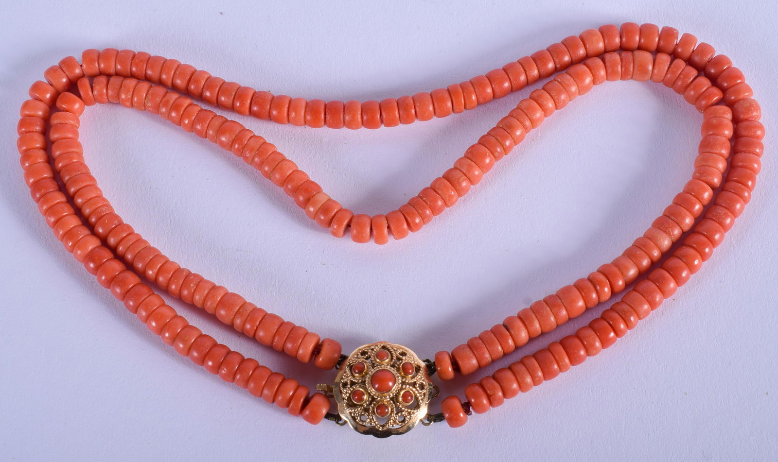 AN 18CT GOLD AND CORAL NECKLACE. Each strand 34 cm (1 of 2)