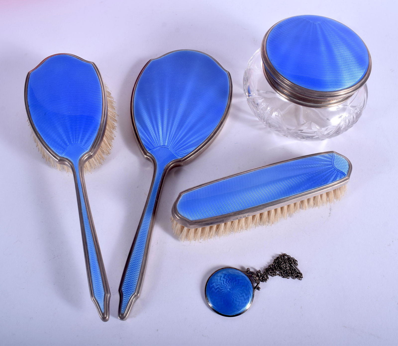 AN ART DECO SILVER AND ENAMEL DRESSING TABLE SET. (1 of 2)