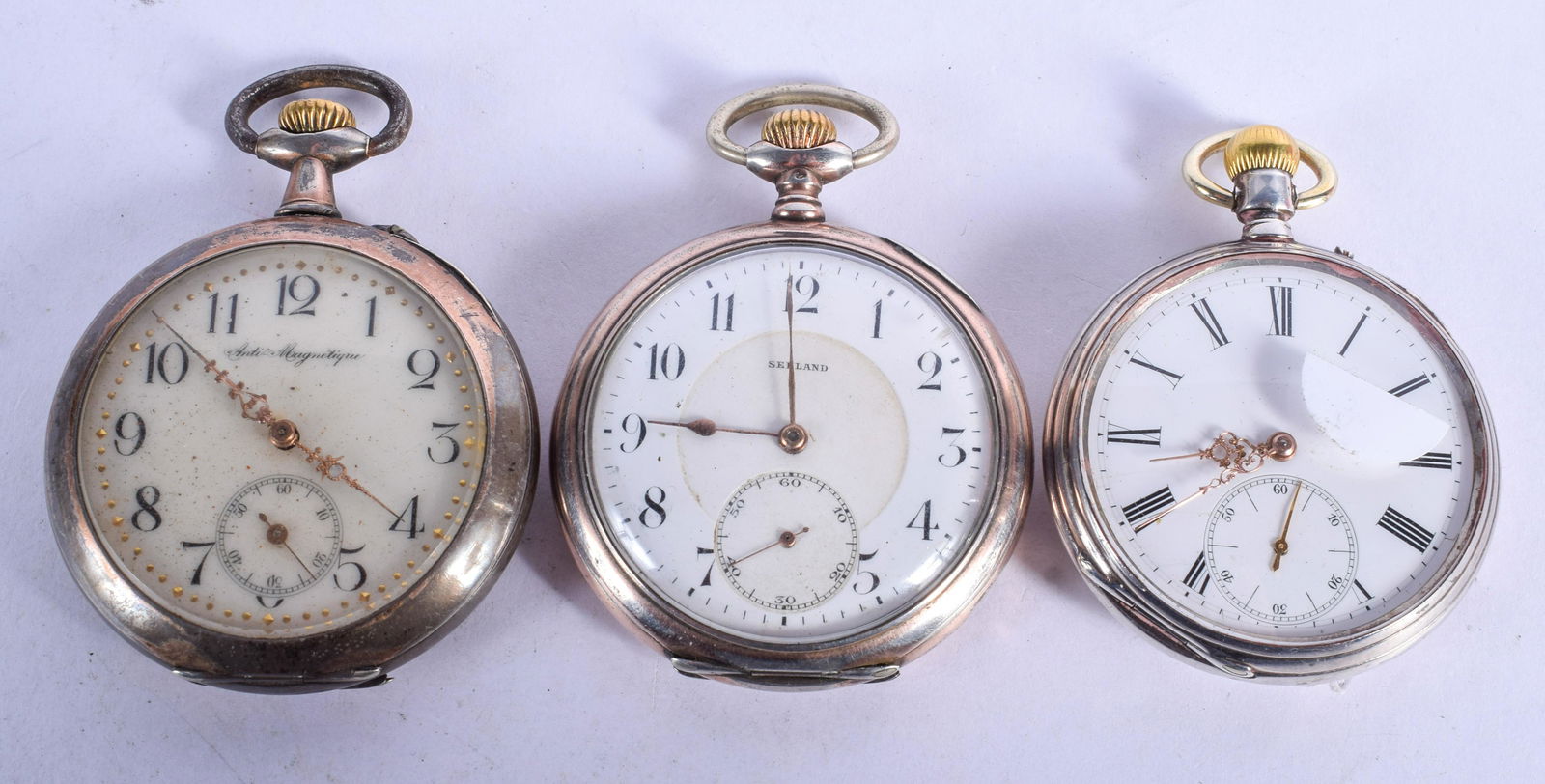 THREE ANTIQUE SILVER POCKET WATCHES. 5 cm wide. (3) (1 of 3)