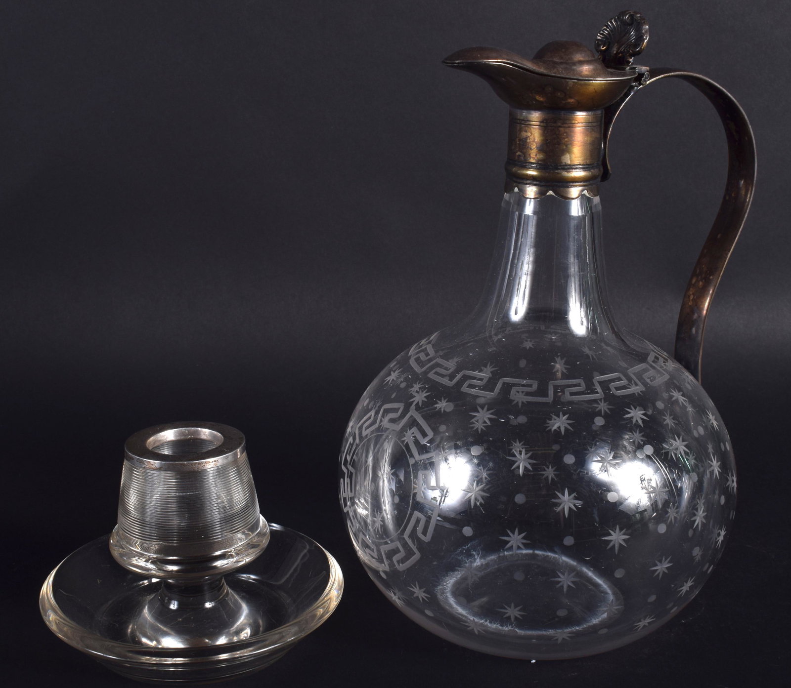 AN EDWARDIAN GLASS DECANTER together with a silver: AN EDWARDIAN GLASS DECANTER together with a silver mounted match striker. 21 cm & 8 cm high. (2)