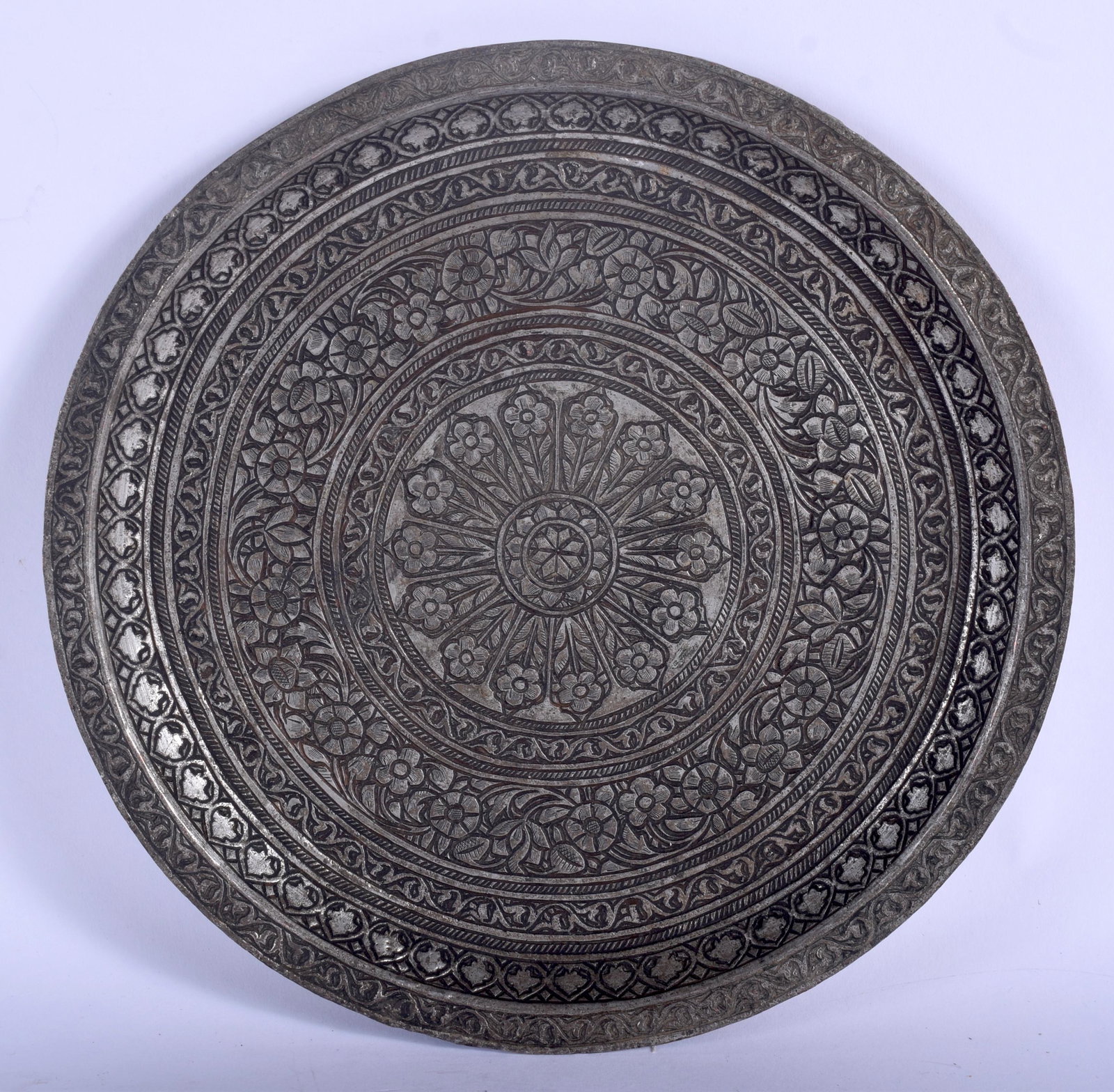 A 17TH CENTURY SAFAVID TINNED COPPER PLATE Persia,: A 17TH CENTURY SAFAVID TINNED COPPER PLATE Persia, decorated with foliage. 18 cm wide.