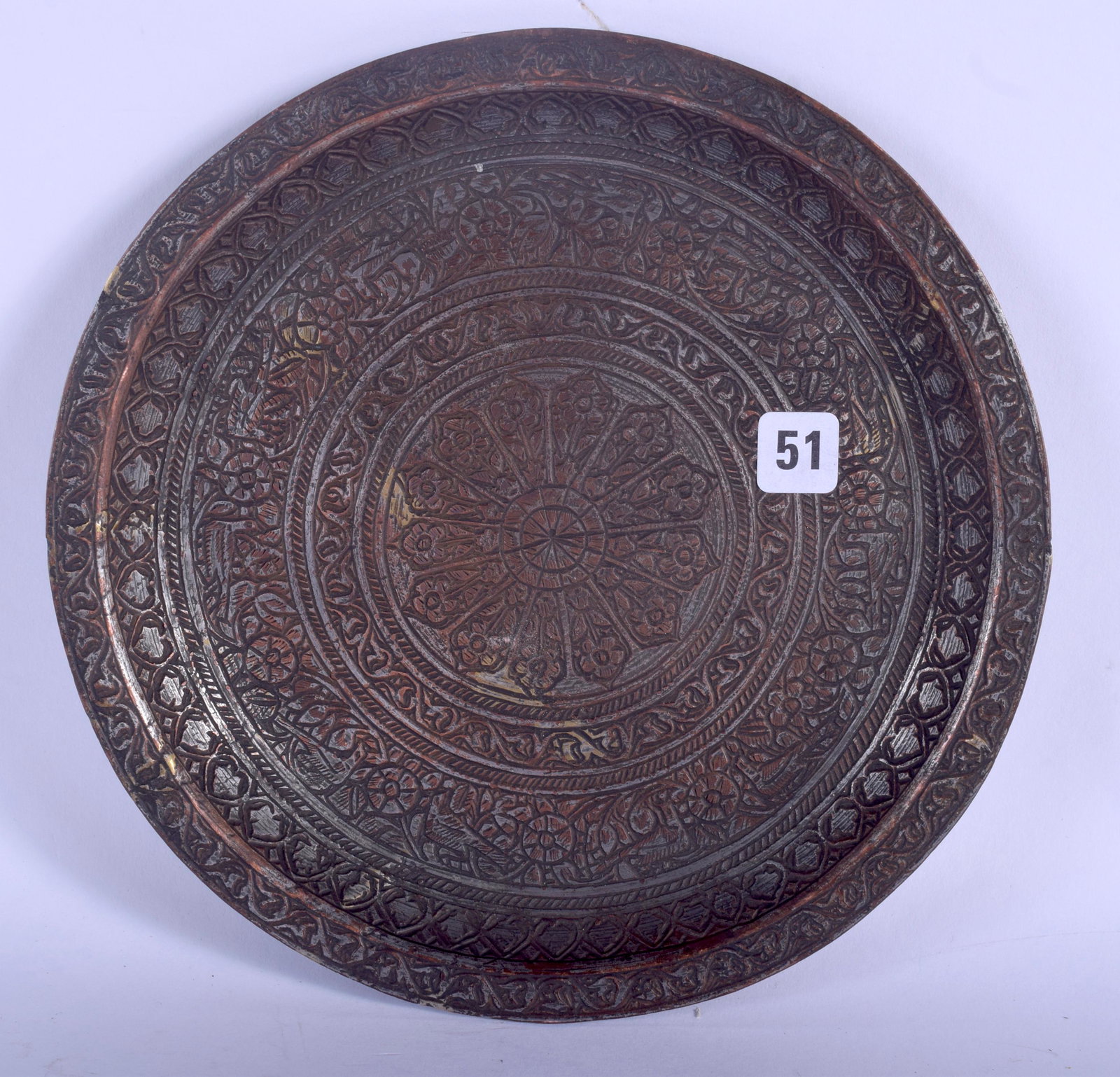 A 17TH CENTURY SAFAVID TINNED COPPER PLATE Persia,: A 17TH CENTURY SAFAVID TINNED COPPER PLATE Persia, decorated with foliage. 15 cm wide.