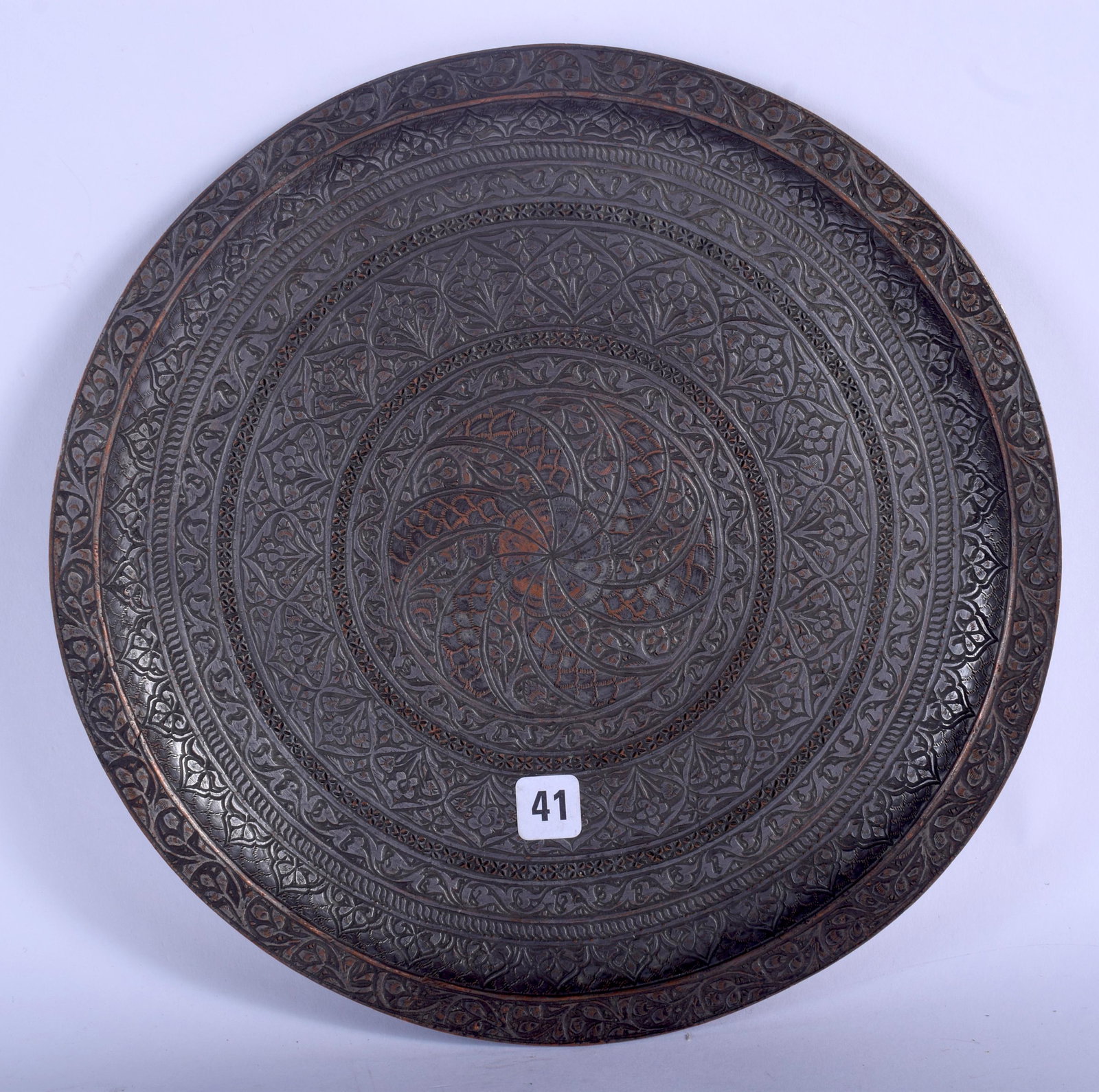 A 17TH CENTURY SAFAVID TINNED COPPER PLATE Persia,: A 17TH CENTURY SAFAVID TINNED COPPER PLATE Persia, decorated with foliage. 18 cm wide.