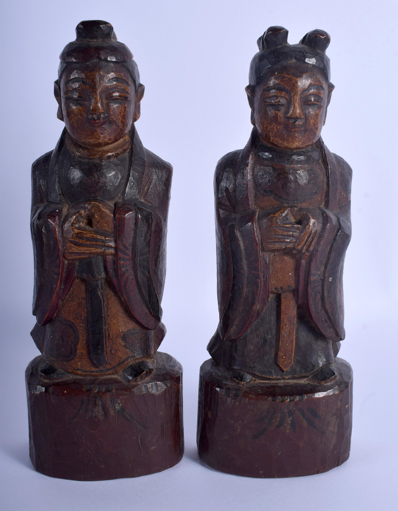 A PAIR OF 19TH CENTURY KOREAN JOSEON DYNASTY CARVED: A PAIR OF 19TH CENTURY KOREAN JOSEON DYNASTY CARVED WOOD BUDDHAS modelled upon wooden plinths. 23 cm x 8 cm.