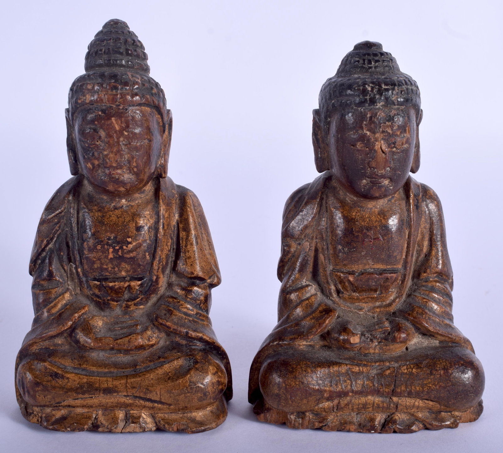 A SMALL RARE PAIR OF 18TH/19TH CENTURY KOREAN JOSEON: A SMALL RARE PAIR OF 18TH/19TH CENTURY KOREAN JOSEON DYNASTY CARVED WOOD BUDDHA modelled seated with hands clasped. 11 cm x 4.5 cm.