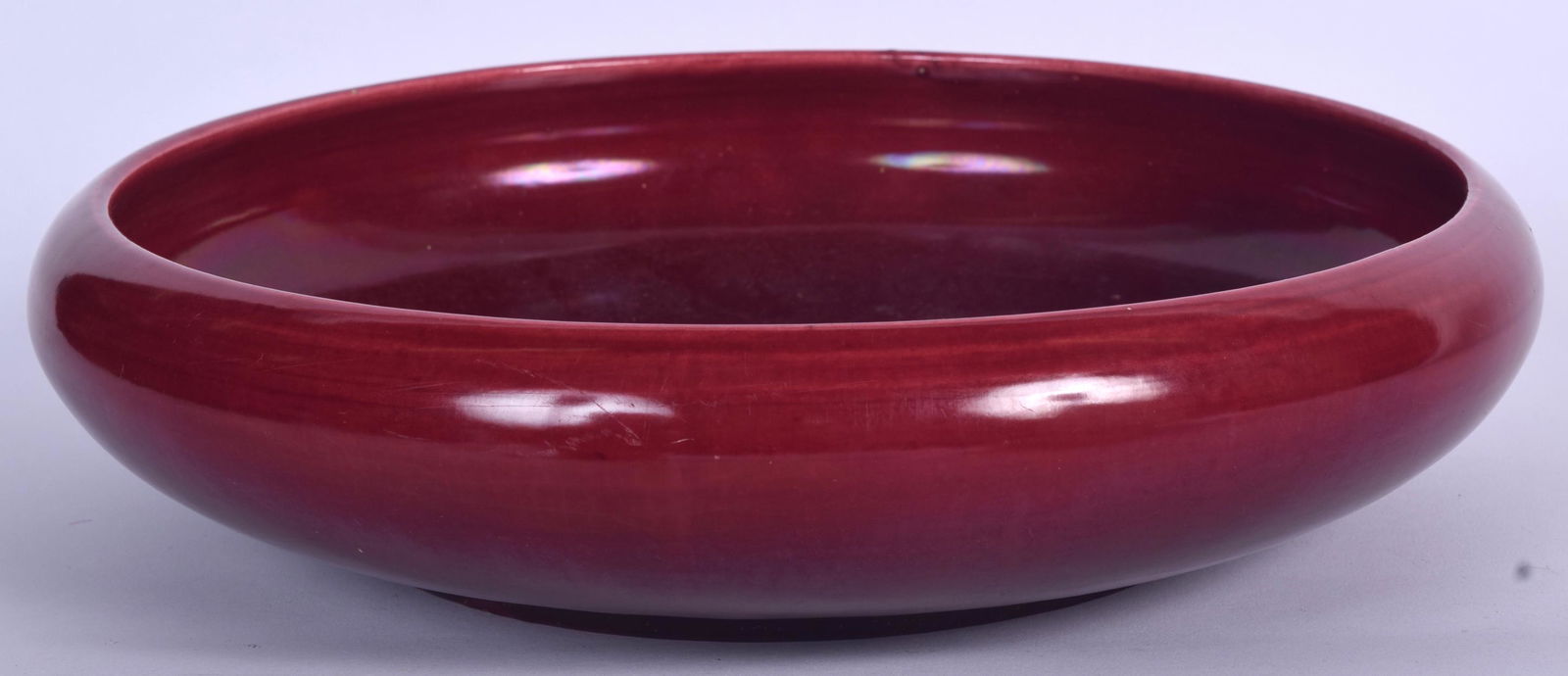 A LARGE FLAMBE GLAZED PORCELAIN BOWL, of plain form. 31 (1 of 2)