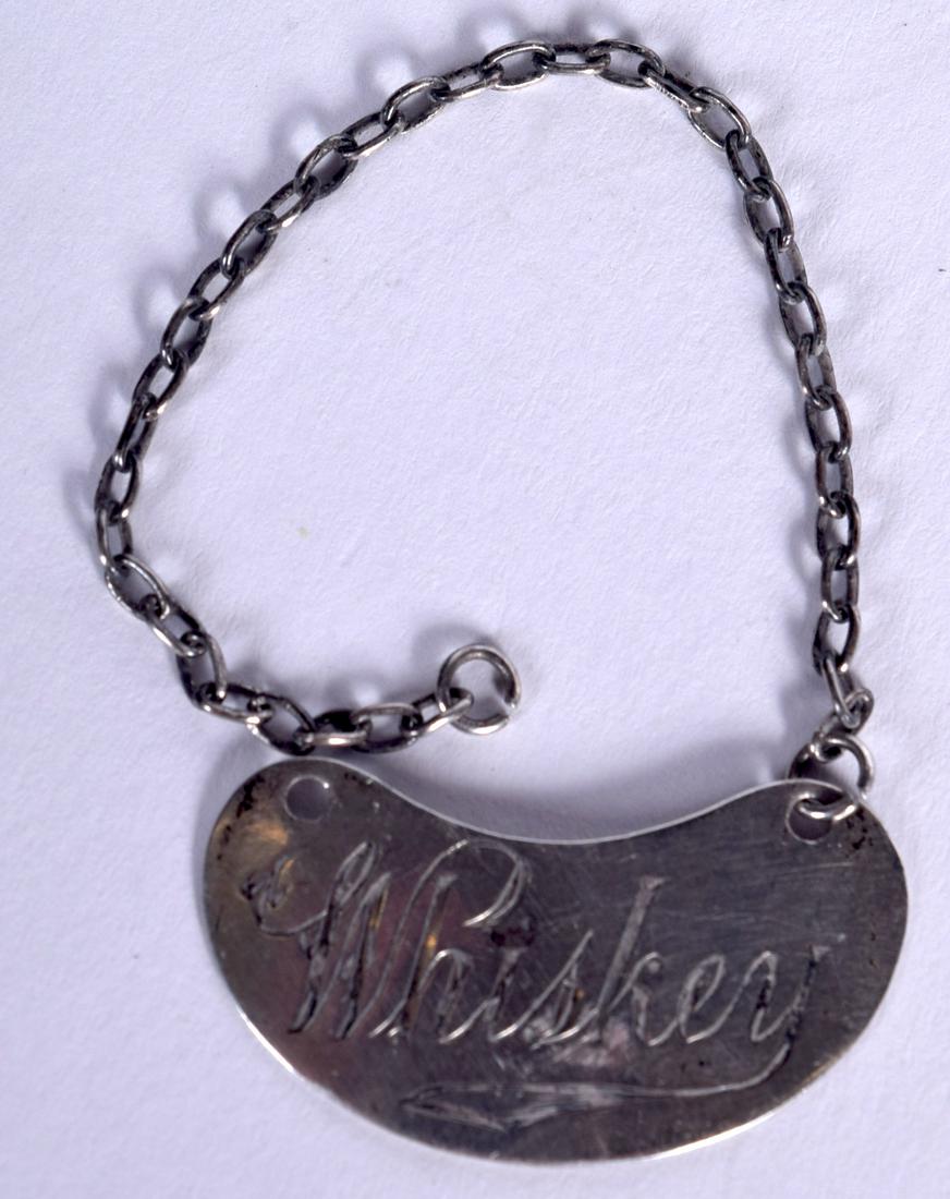 A SOLID SILVER WHISKEY DECANTER LABEL, bearing (1 of 2)