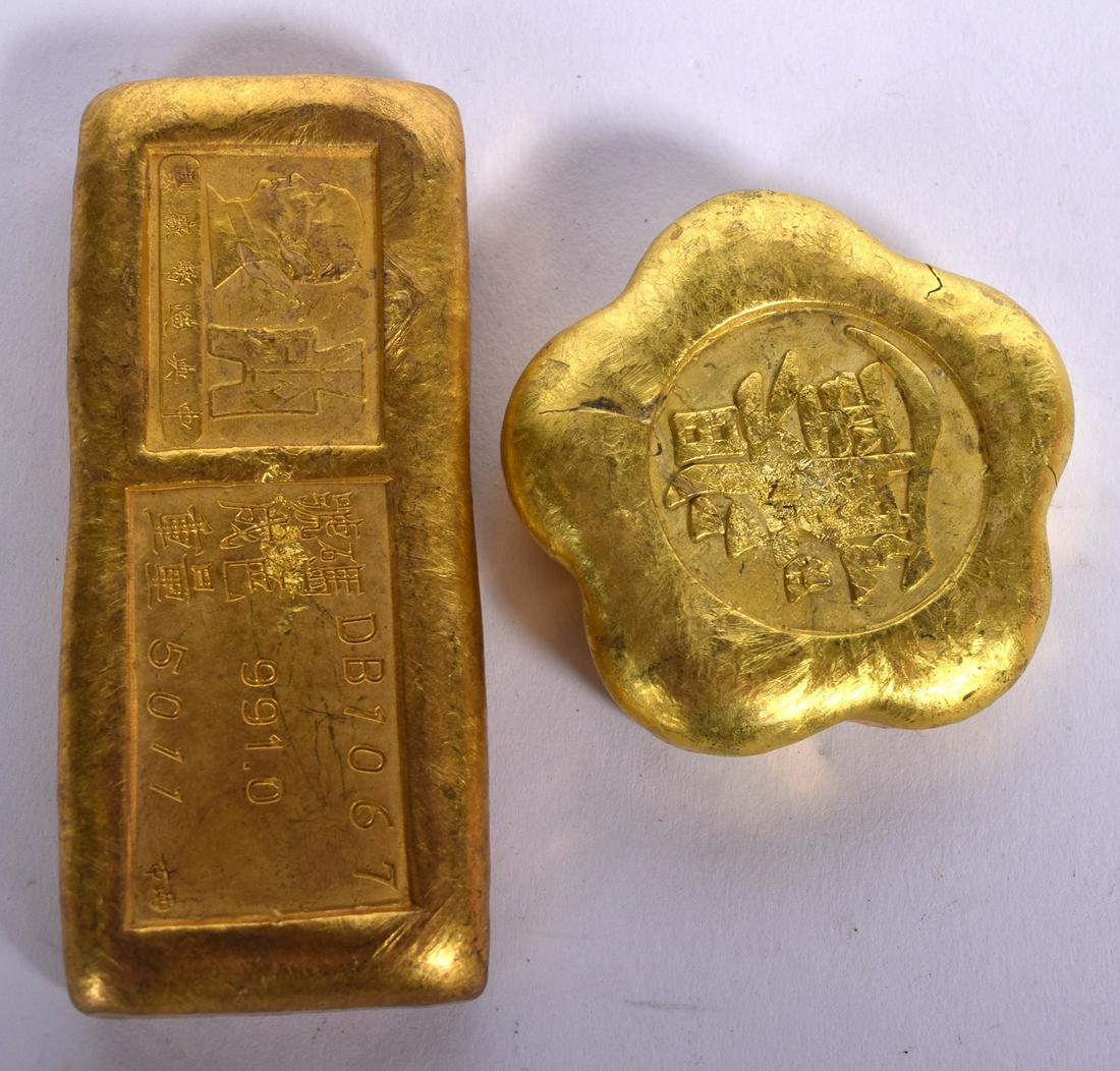 TWO CHINESE YELLOW METAL INGOTS. Largest 6.75 cm wide. (1 of 2)