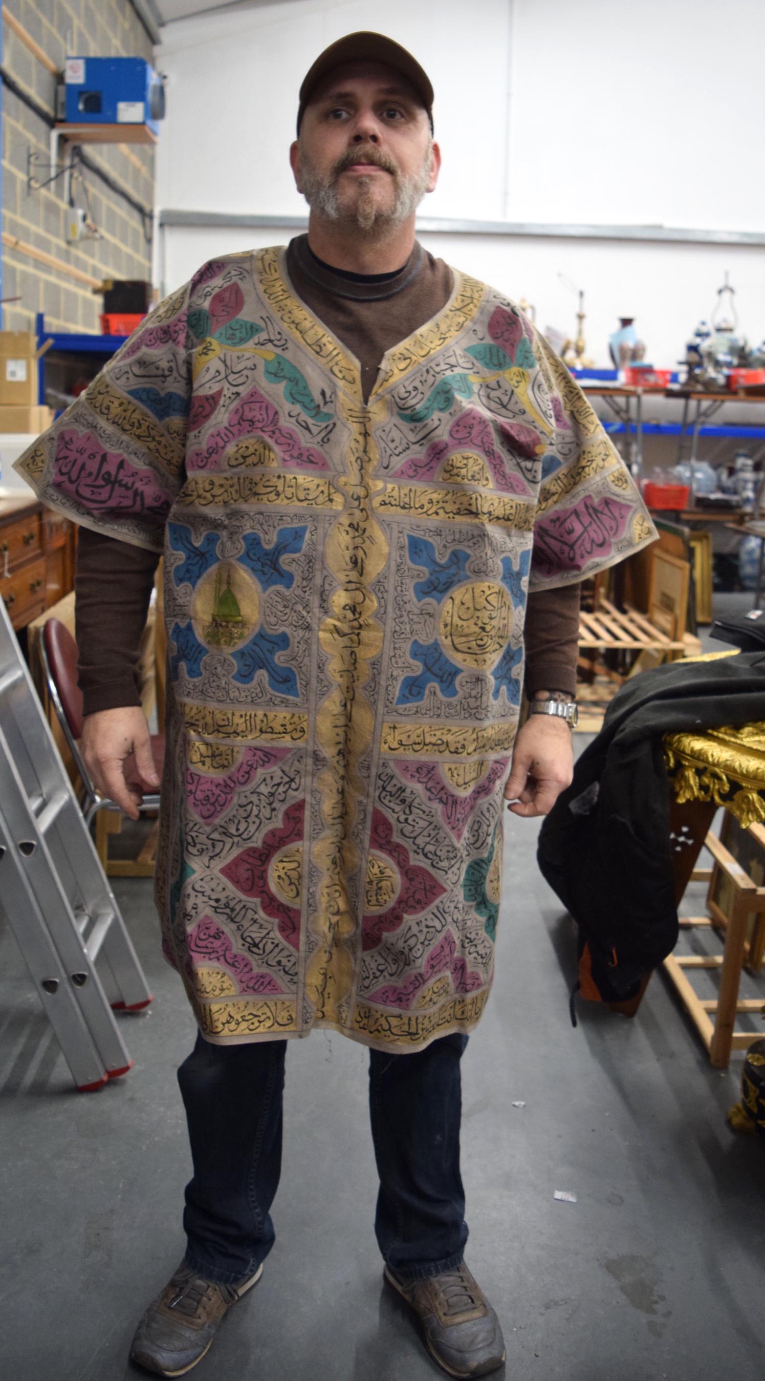 AN ISLAMIC TALISMANIC SHIRT ROBE, decorated with panels (1 of 4)