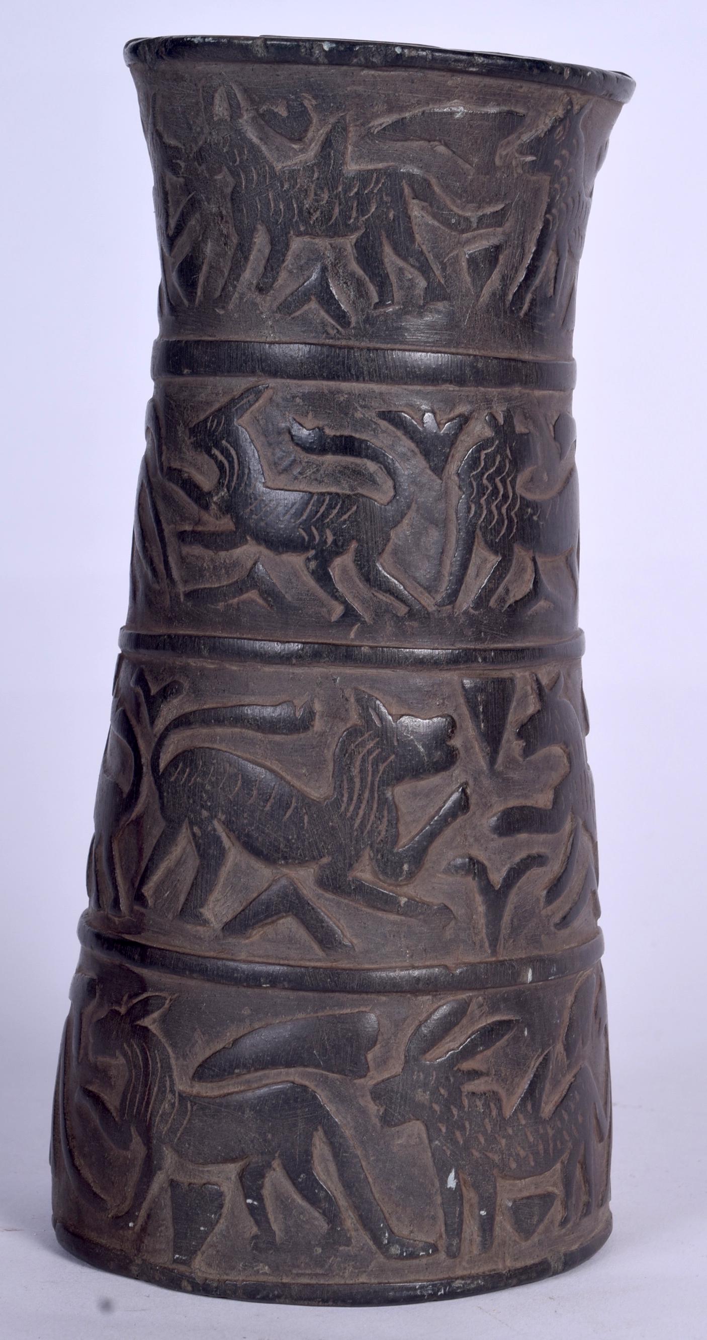 A BACTRIAN STONE COLUMN, carved in relief with animals. (1 of 1)