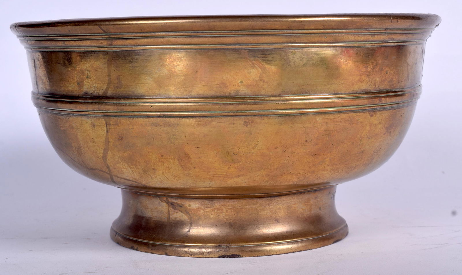 A LARGE 19TH CENTURY BRASS PEDESTAL BOWL, formed with a (1 of 2)