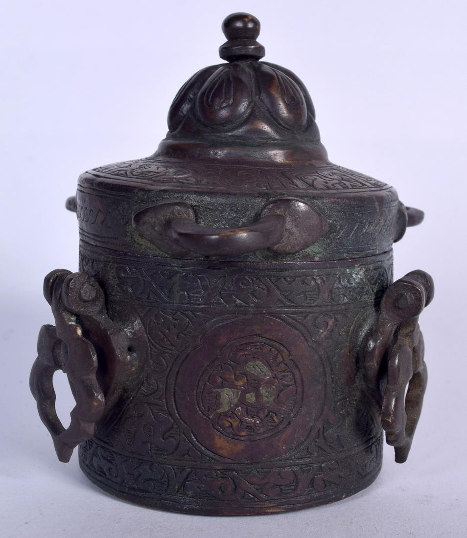 AN ISLAMIC BRONZE BOX AND COVER, decorated with script (1 of 1)