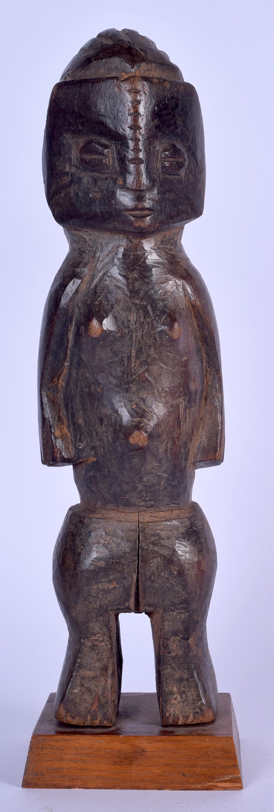 A CONGOLESE BEMBE CARVED WOODEN FIGURE, formed standing (1 of 3)