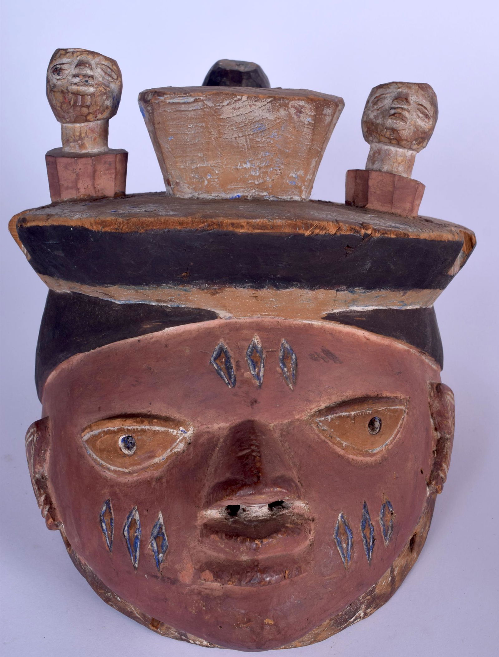 A NIGERIAN YORUBA WOODEN POLYCHROMED GELEDE MASK, (1 of 3)