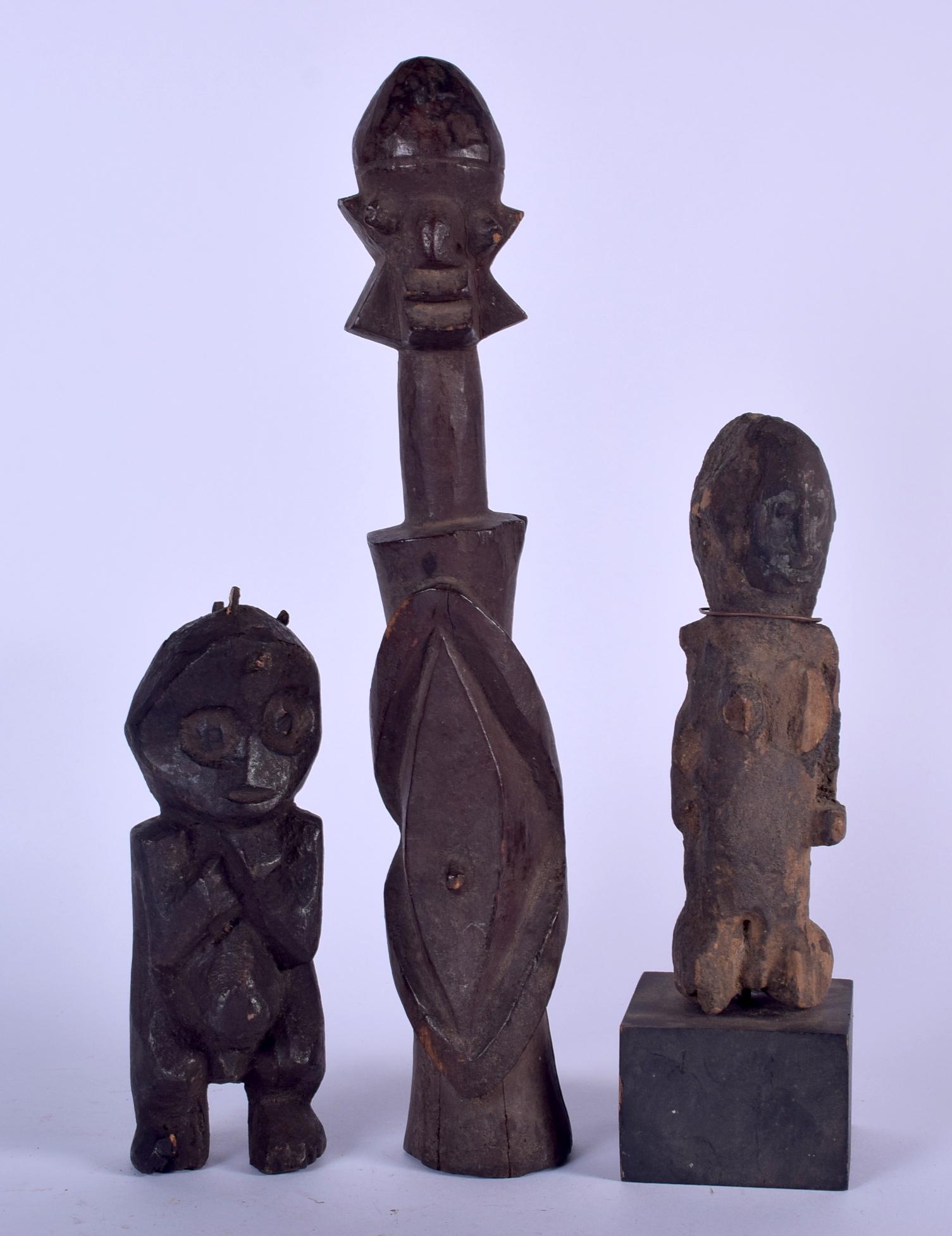 THREE AFRICAN CARVED WOODEN FIGURES, varying form. (1 of 1)