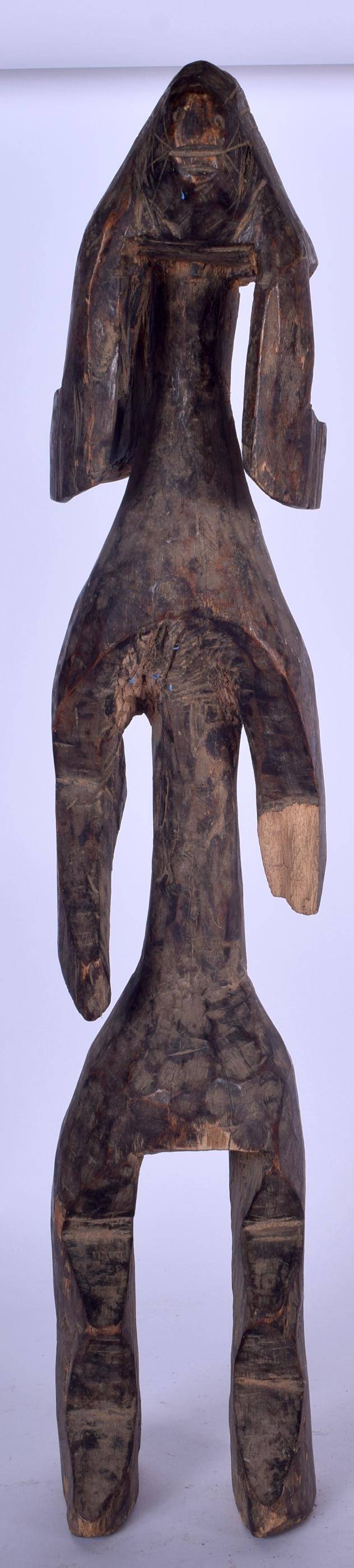 A WEST AFRICAN CARVED WOODEN STATUE, zoomorphic in (1 of 1)