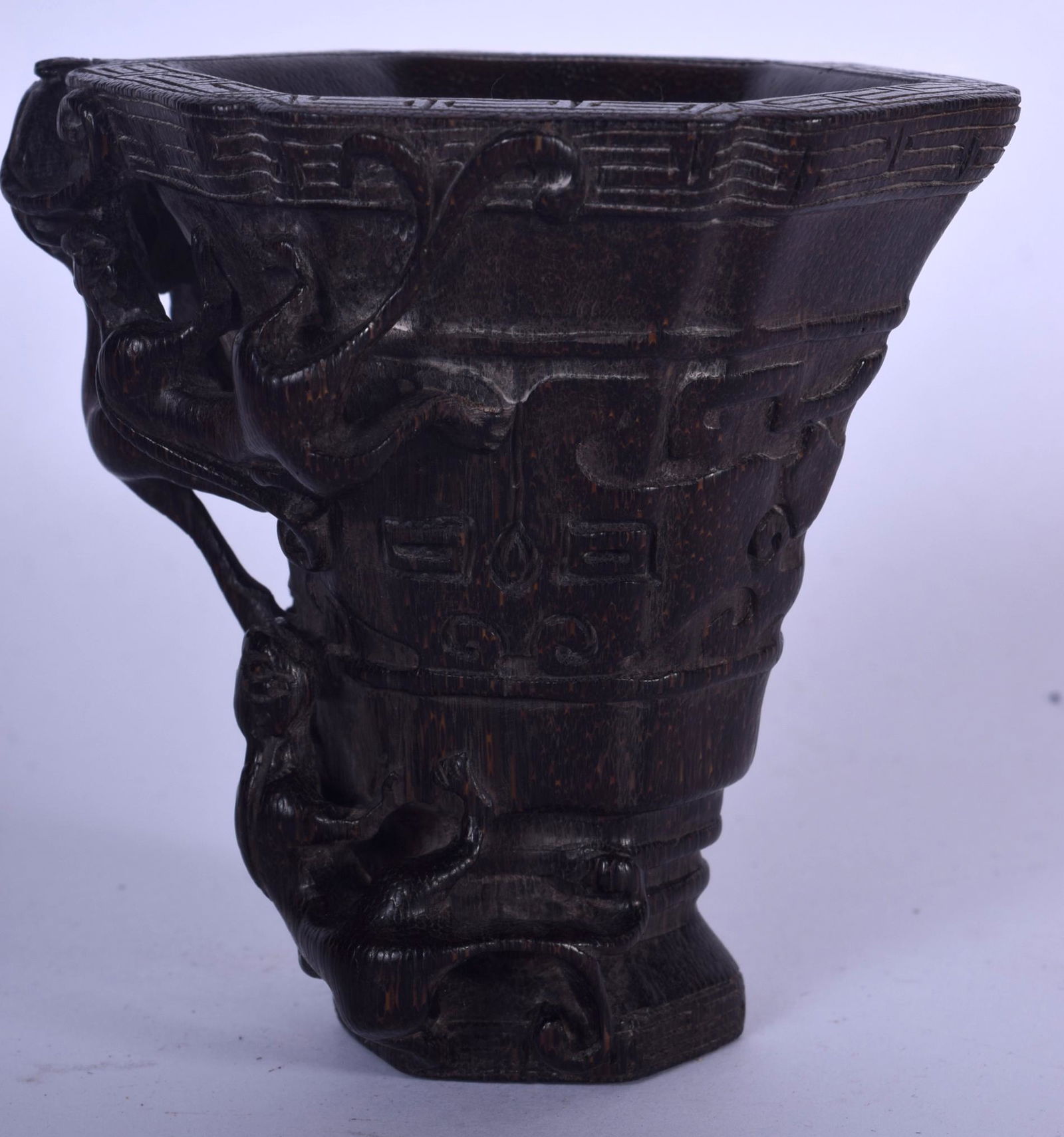 A GOOD CHINESE CARVED BAMBOO LIBATION CUP, formed with (1 of 3)