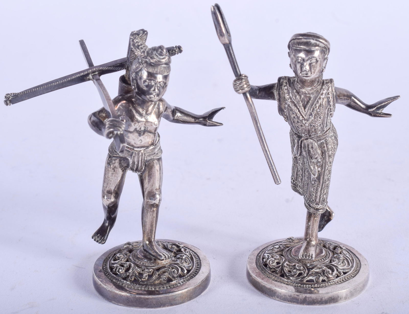 A PAIR OF VINTAGE THAI BURMESE SILVER FIGURES. 4.1 oz.: A PAIR OF VINTAGE THAI BURMESE SILVER FIGURES. 4.1 oz. 9 cm high.
