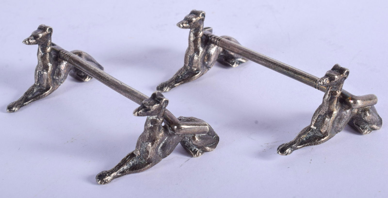 A PAIR OF VINTAGE HOUND AND RIDING CROP KNIFE RESTS. 8 (1 of 2)